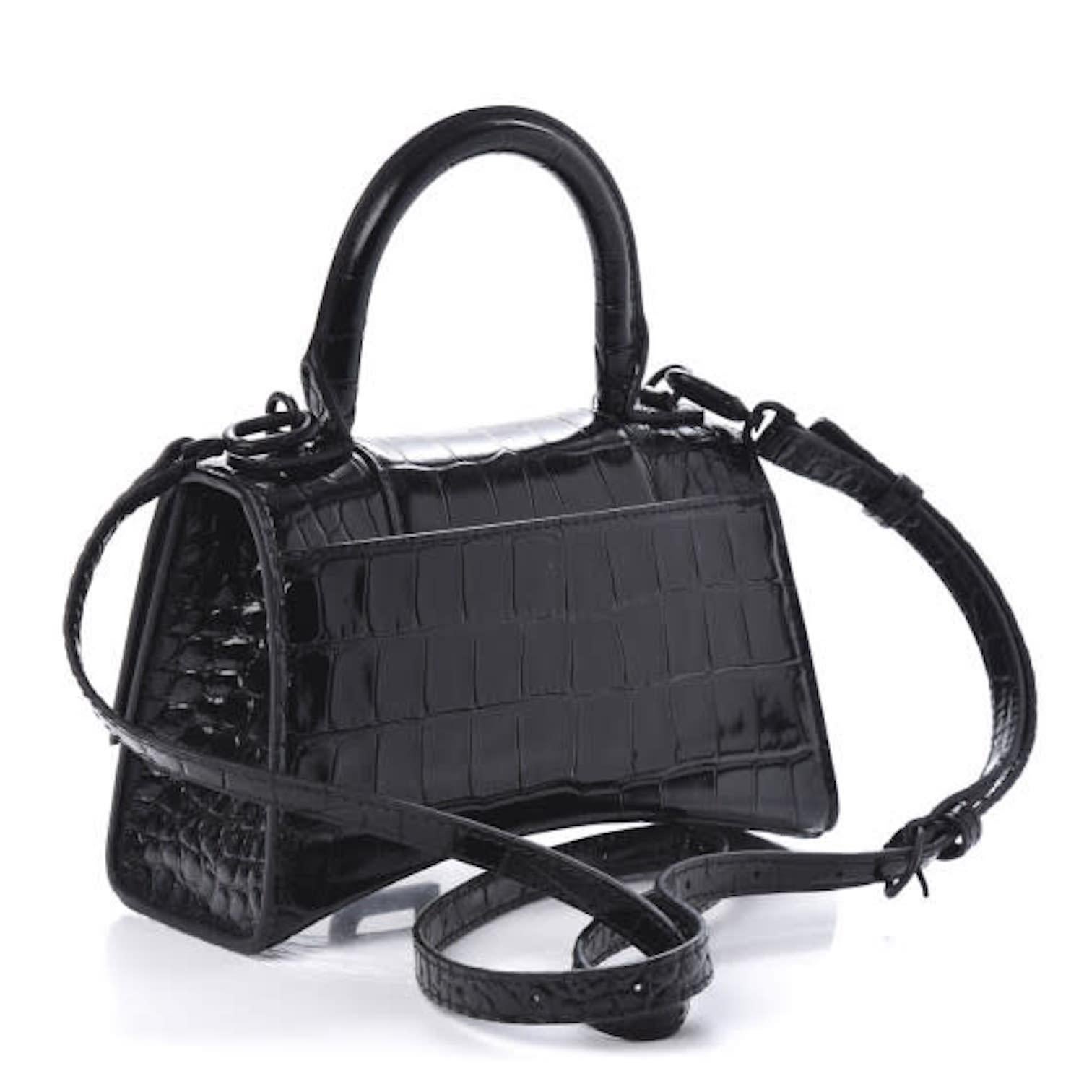 Petite handbag made of crocodile stamped glazed calfskin in black. Features a top handle and an optional shoulder strap. Also features the signature Balenciaga B charm, matte black hardware, and slip pocket at back. 

COLOR: Black
MATERIAL: