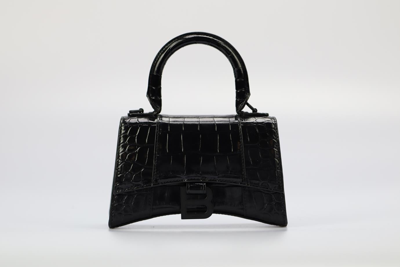 Balenciaga Hourglass Xs Croc Effect Leather Tote Bag. Black. Magnetic fastening - Front. Does not come with - dustbag or box. Height: 5 in. Width: 7.3 in. Depth: 2.7 in. Handle drop: 3 in. Condition: Used. Very good condition - Shoulder strap