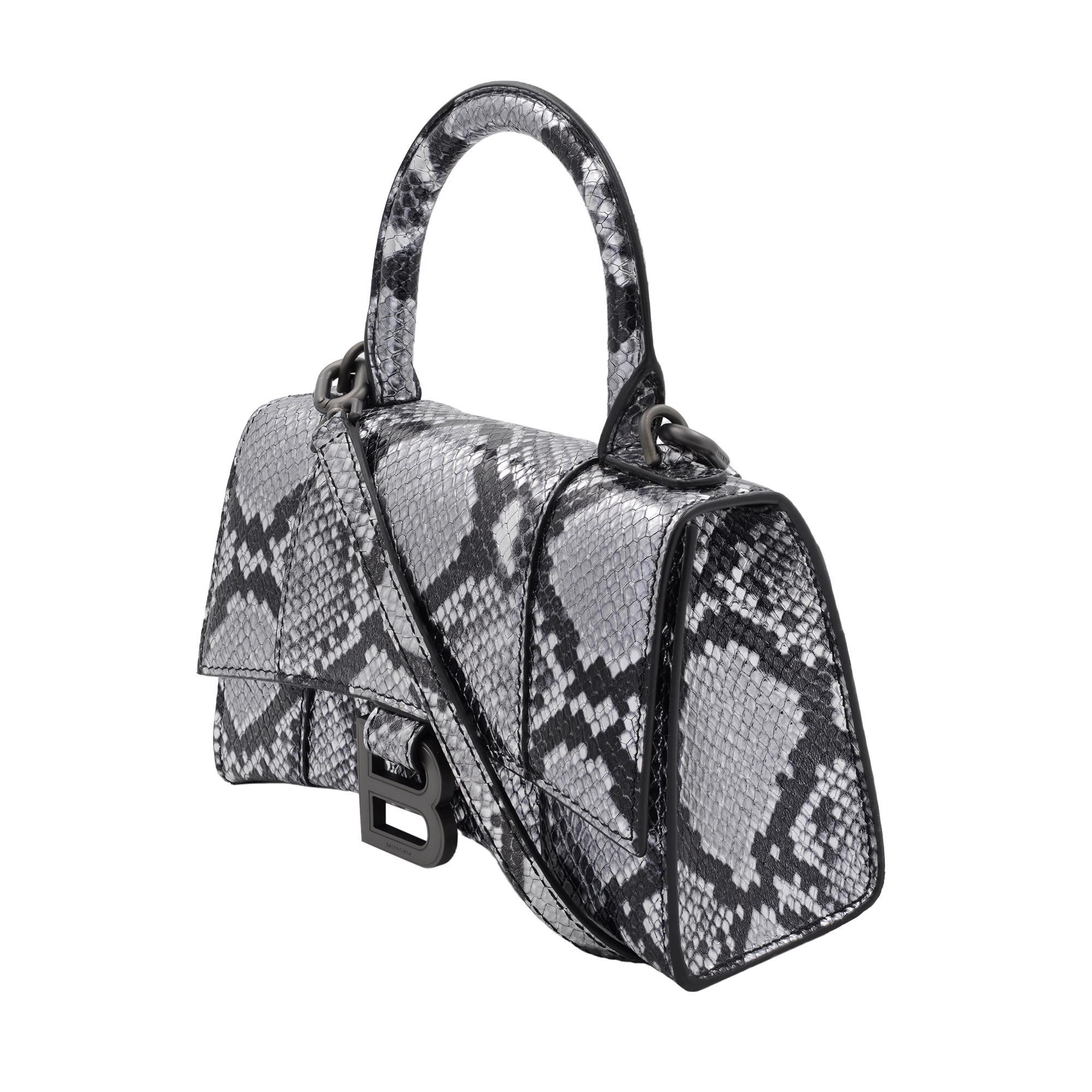 Balenciaga Hourglass XS metallic python embossed Leather women's to handle bag. Includes adjustable strap, 8.5-23 inches. Can be worn as a shoulder or handbag. Dimensions : H 4.5 inches x W 7.5 inches x D 3 inches. Made in Italy. Unworn condition.