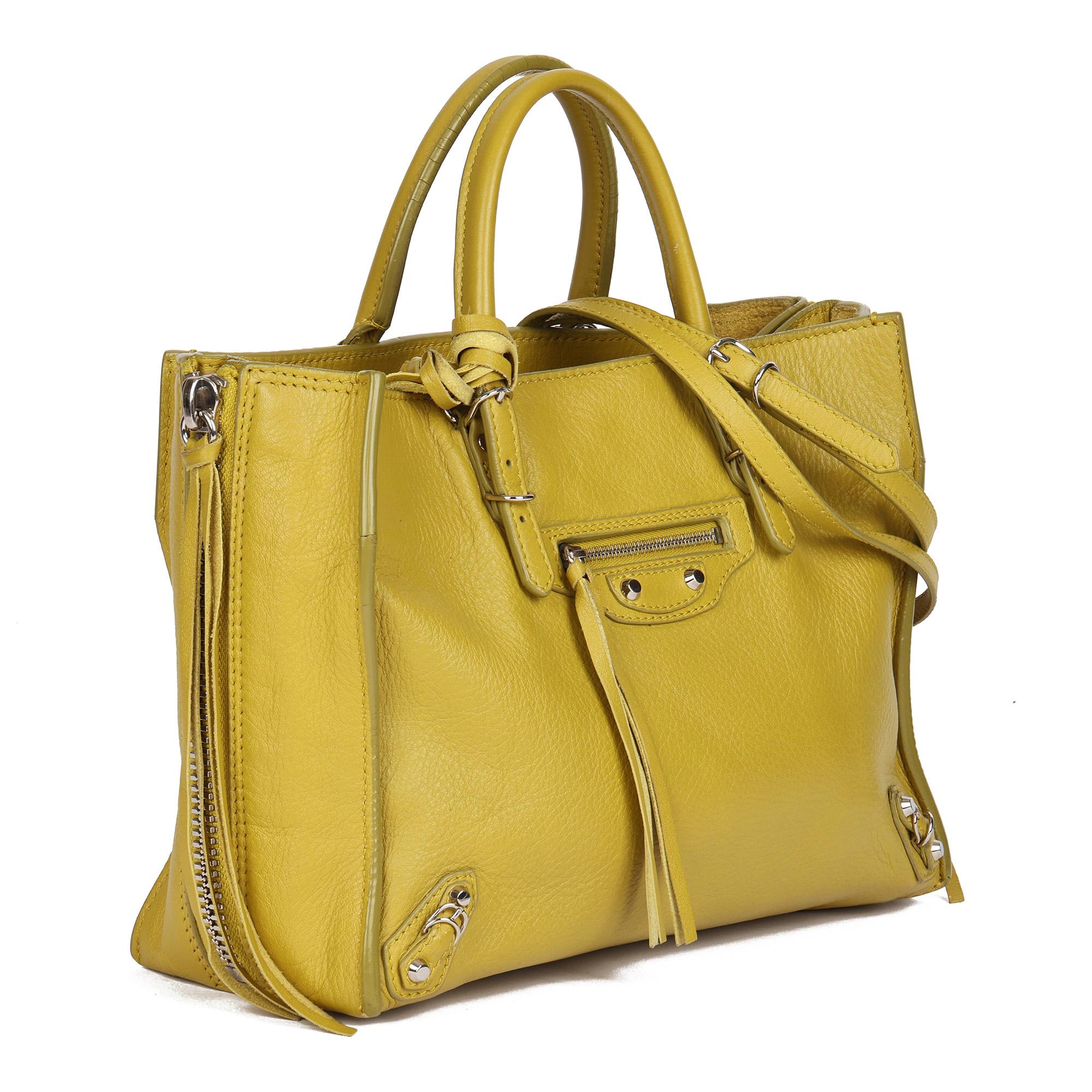 BALENCIAGA
Jaune Citronnade Goatskin Leather Papier Mini

Serial Number: 370926.7325.E.535269
Age (Circa): 2010
Accompanied By: Balenciaga Shoulder Strap, Detachable Mirror
Authenticity Details: Date Stamp (Made in Italy)
Gender: Ladies
Type: Tote,