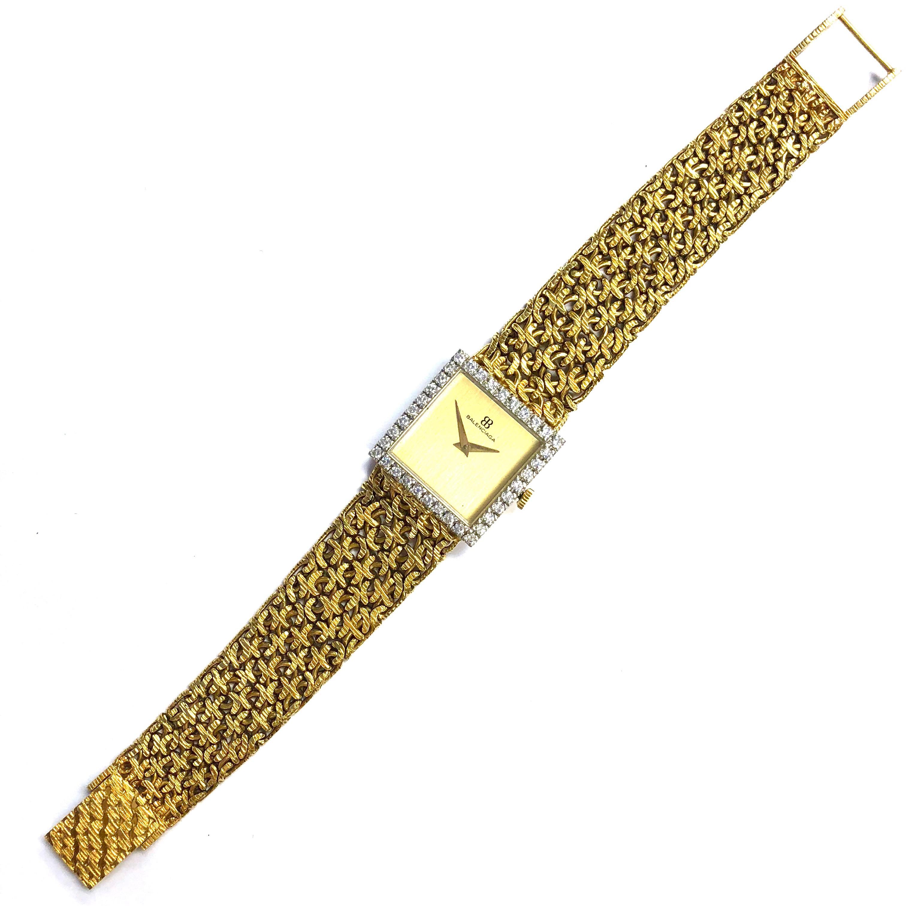 Rare Balenciaga 18K gold and diamond bezel watch. Classic, rich, elegant. Crafted in 18K gold, the watch features a square shaped white gold case with yellow gold back, diamond bezel, gold dial with gold hour markers, and a gold crown. The case is