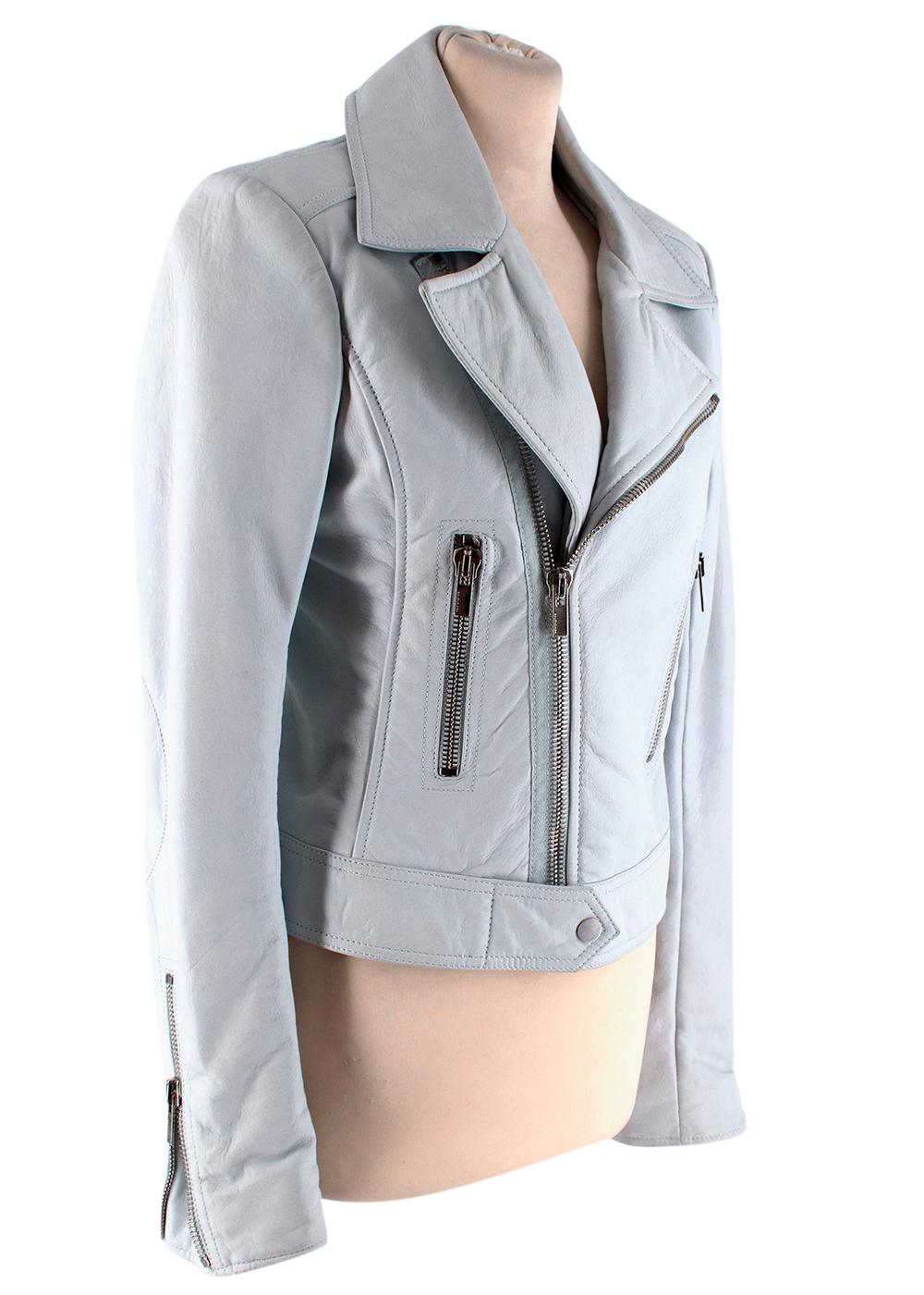 Balenciaga Lamb Skin Leather Jacket

- Soft lamb skin with a slight natural texture
- Padded shoulders for a structured look
- Silver zip hardware on the cuffs and front opening
- Pockets each side
- Ice blue hemlines
- Embroidered stitching on the