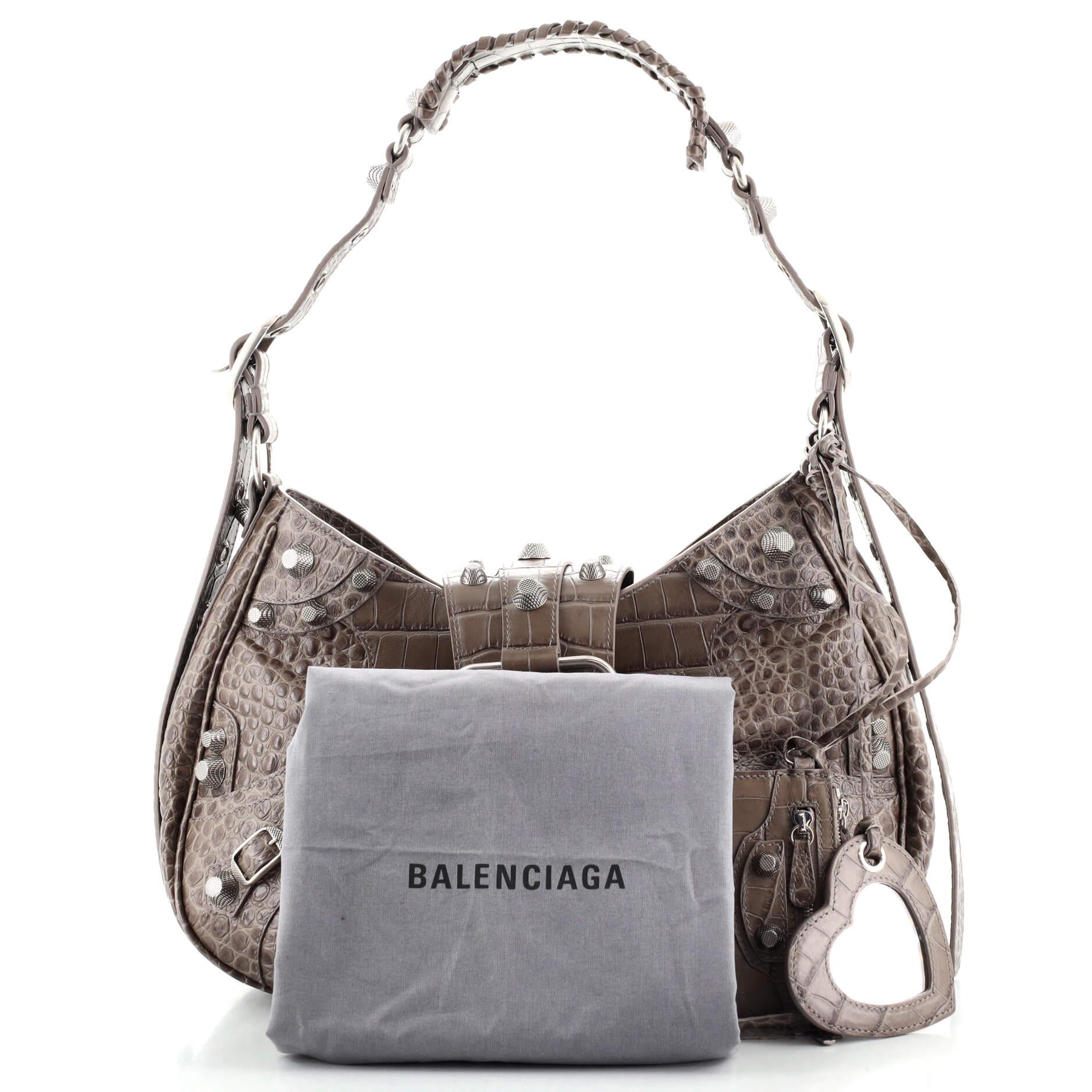 This item can only be shipped within the United States.

Condition: Great. Minor wear and piling in interior, scratches on hardware
Accessories: Pochette, Dust Bag, Mirror, With Strap
Measurements: Height 9