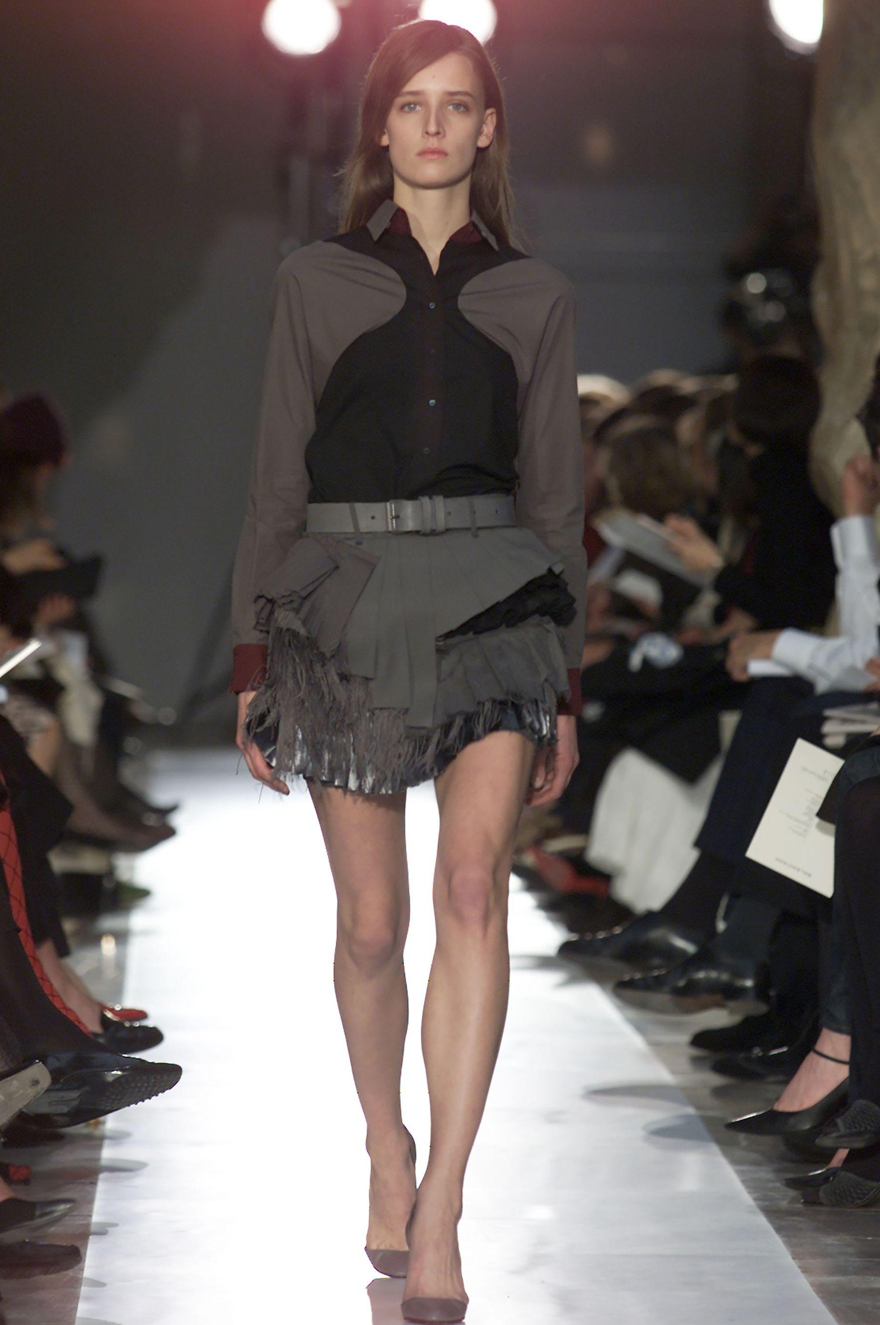 A rare early 2000s archival piece from Ghesquière’s influential Le Dix era at Balenciaga
A striking example of his visionary tailoring, this shirt plays on proportion and architectural lines with its curved shoulder panels and subtle