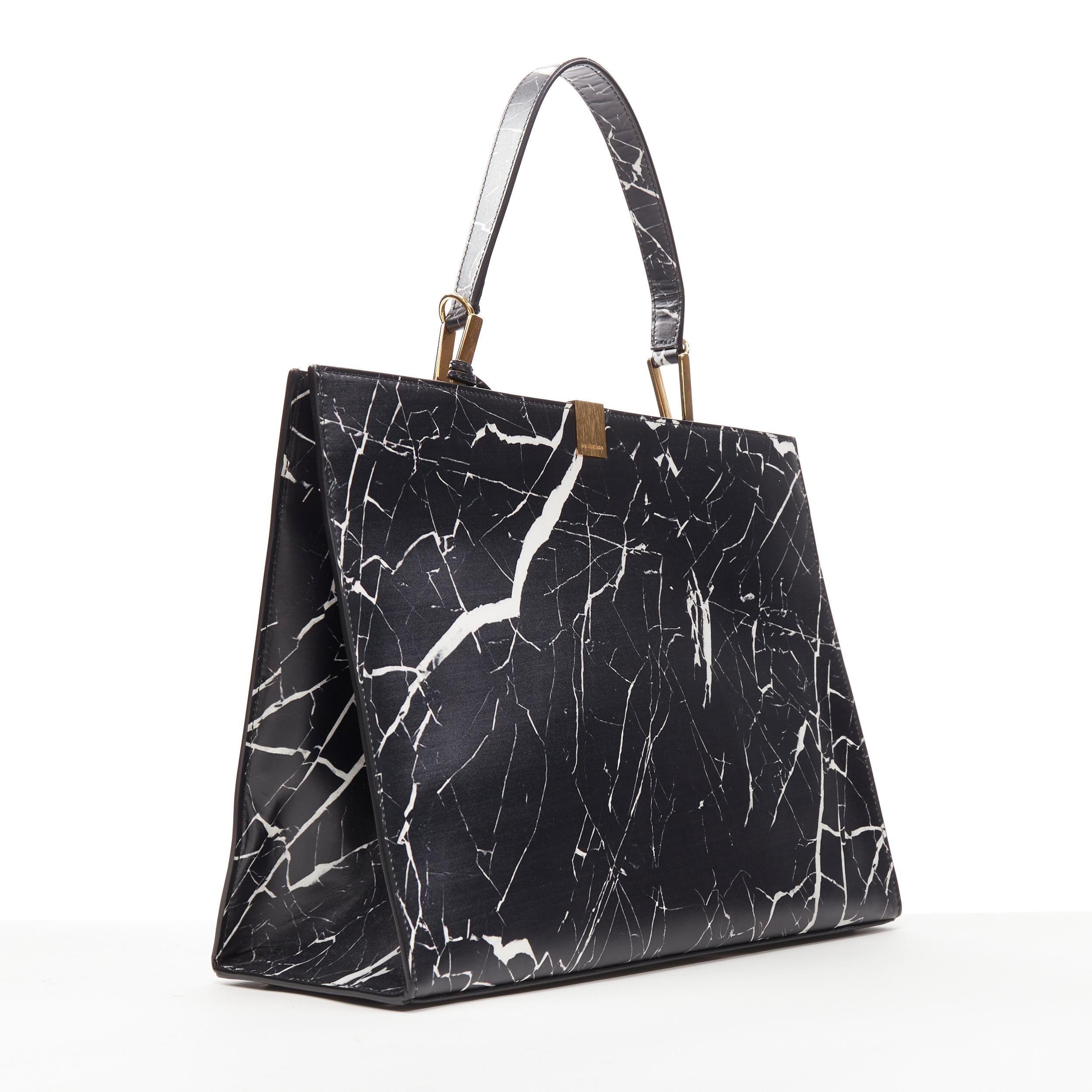 BALENCIAGA Le Dix Cabas black marble print top handle structured tote bag 
Reference: AEMA/A00010 
Brand: Balenciaga 
Model: Le Dix Cabas 
Material: Leather 
Color: Black 
Pattern: Abstract 
Closure: Clasp 
Extra Detail: Le Dix Cabas. Black white