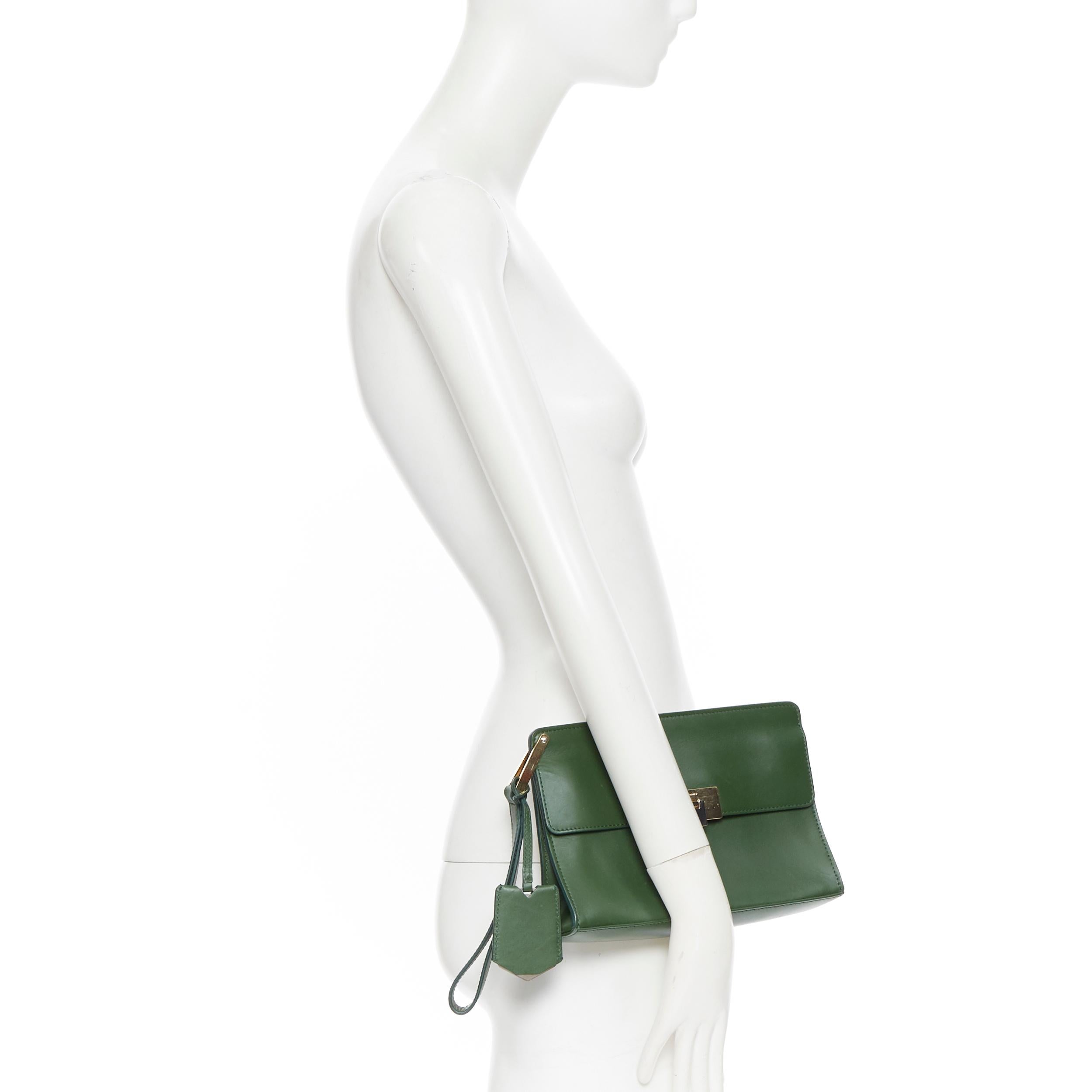 BALENCIAGA Le Dix Pochette geren leather mixed metal wristlet pocket clutch bag
Brand: Balenciaga
Model Name / Style: Le Dix
Material: Leather
Color: Green
Pattern: Solid
Closure: Clasp
Extra Detail: Green leather upper. Mixed gold and silver-tone