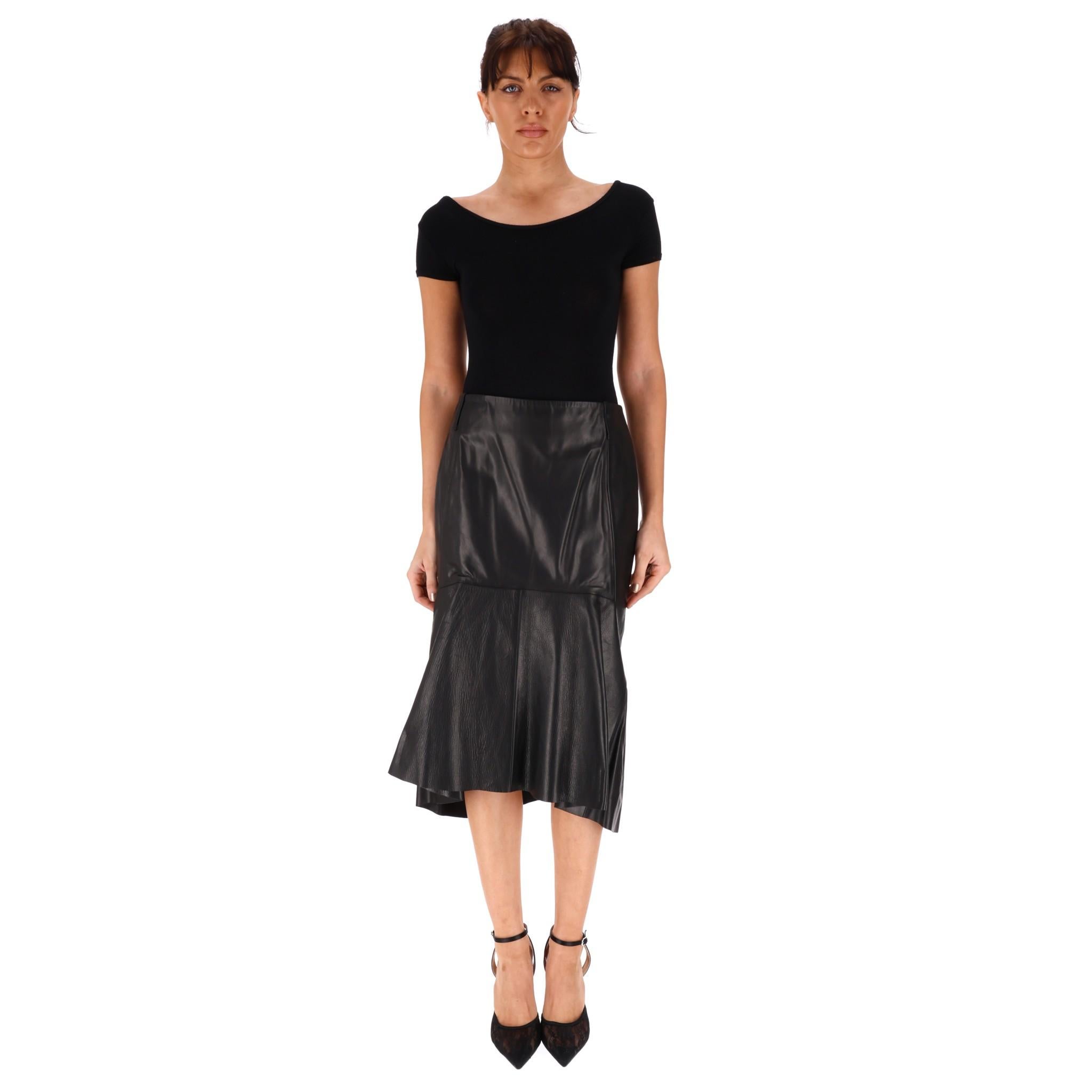 Balenciaga Leather Godet Skirt

Black midi skirt crafted from glossy buffed calfskin leather.

Godet panel to the front and asymmetric raw edged hem.

'Balenciaga' engraved zip closure to rear, high waist.

Rrp Approx. £2,500

Size – 38FR

Condition