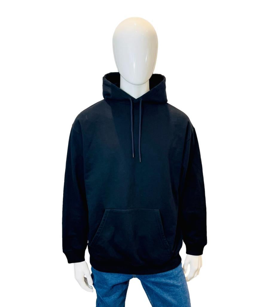 Balenciaga Logo Cotton Hoodie
Black hoodie designed in a classic relaxed silhouette with ribbed trims and drawstring fastening at the hood. 
Featuring 'Balenciaga' logo lettering printed in white on the back. Rrp £790
Size –  L
Condition – Very Good