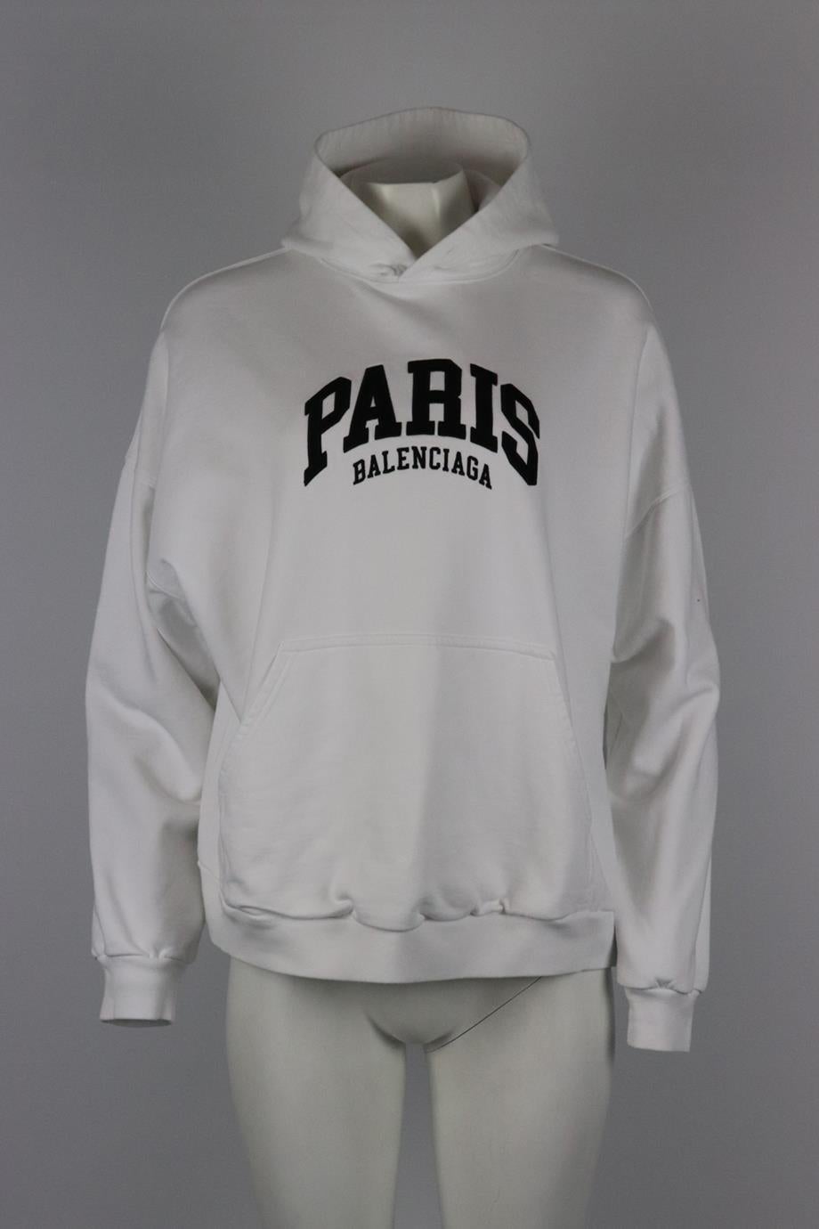 Balenciaga logo embroidered cotton jersey hoodie. White and black. Long sleeve, crewneck. Slips on. 100% Cotton; embroidery: 55% cotton, 45% polyester. Size: Large (UK 12, US 8, FR 40, IT 44). Bust: 51 in. Waist: 48 in. Hips: 44 in. Length: 24 in.