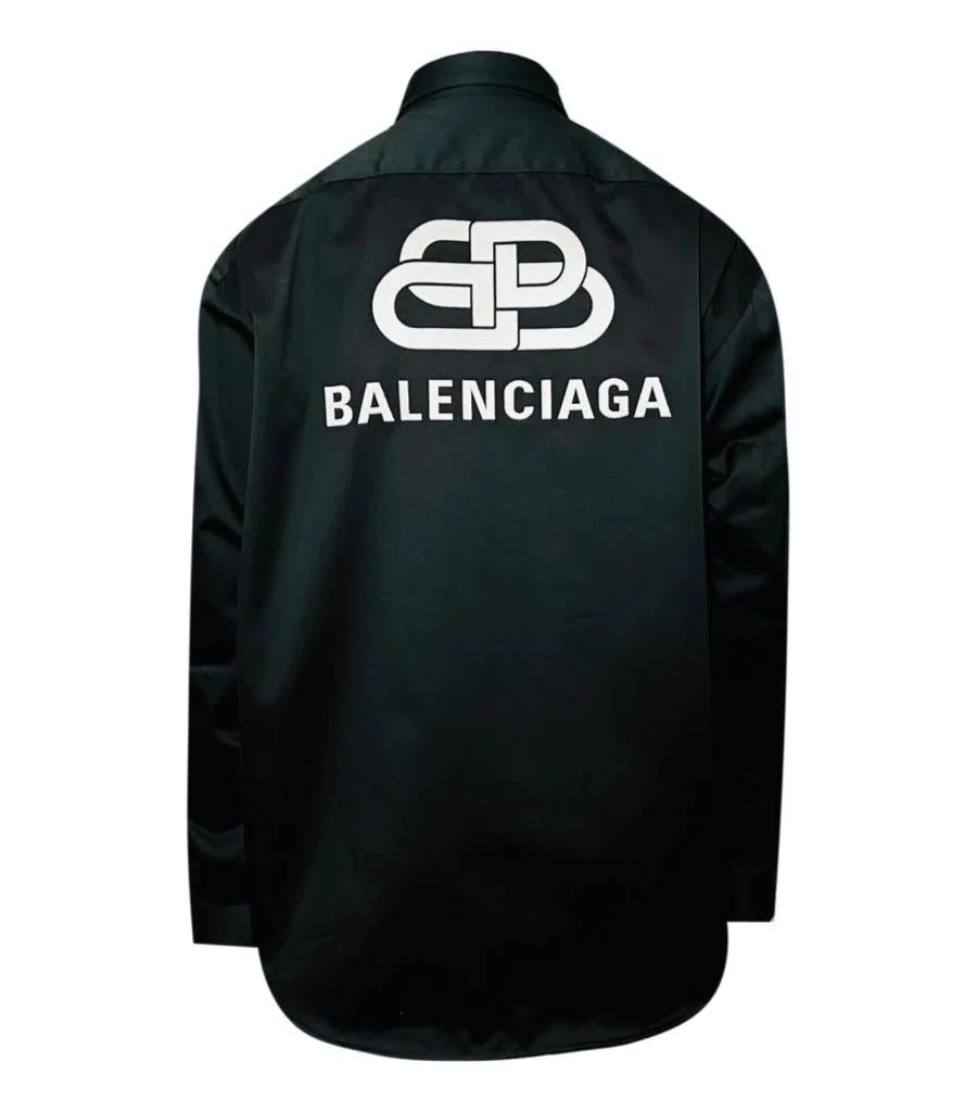 Balenciaga Logo Shirt

Black double sleeved shirt with embroidered logo bade to the front and large white logo to the back. Rrp £750

Size - 38
Condition - Very Good
Composition - 50% Cotton, 50% Polyester