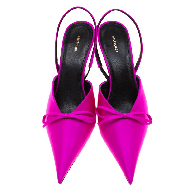 If you are an admirer of the latest fashion trends, this pair of Balenciaga sandals will add just the right vibe to your closet. The pointed-toe pumps are covered in magenta satin and detailed with bows, slingback straps and 9.5 cm heels.

Includes: