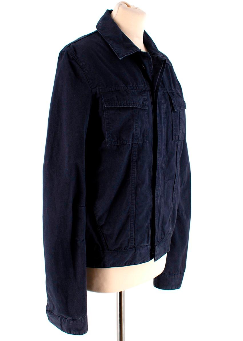 Balenciaga Navy cotton jacket with pencil pockets

- Size 46 (Small)

- Hidden buttons on the sleeves and body

- Inside pocket

All measurements are taken seam to seam:
Shoulder to Shoulder:40cm
Waist:109cm
Length:67cm
Sleeve Length:65cm

