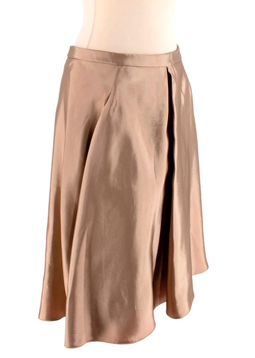 Balenciaga Metallic Beige Shot Silk-Blend Satin A-Line Skirt

- Rich gold shot silk satin
- Contrasting bright red interior colour with black taped seams
- Single inverted pleat front
- Concealed zip and hook closure at the back
- Two slit side