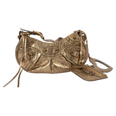 Balenciaga Borsa a tracolla LE CAGOLE XS in pelle Arena color oro metallizzato.