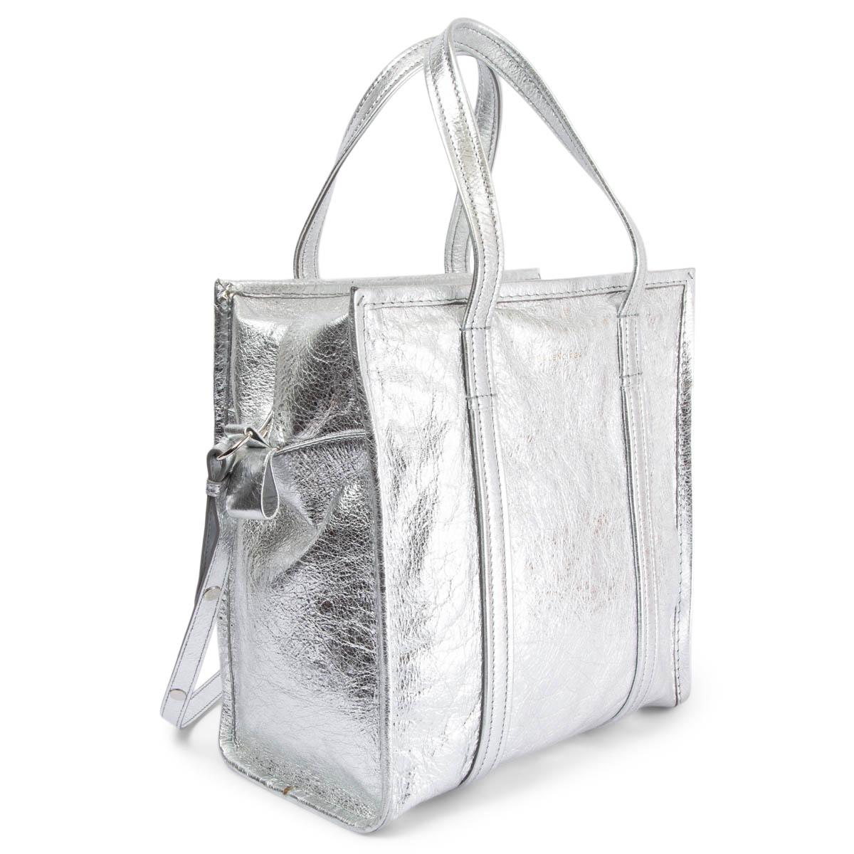 100% authentic Balenciaga Small Bazar shoulder bag in metallic silver crinkled calfskin. Lined in black canvas with one silver leather zip pocket against the back and an open pocket against the front. Comes with a detachable shoulder-strap. Has been