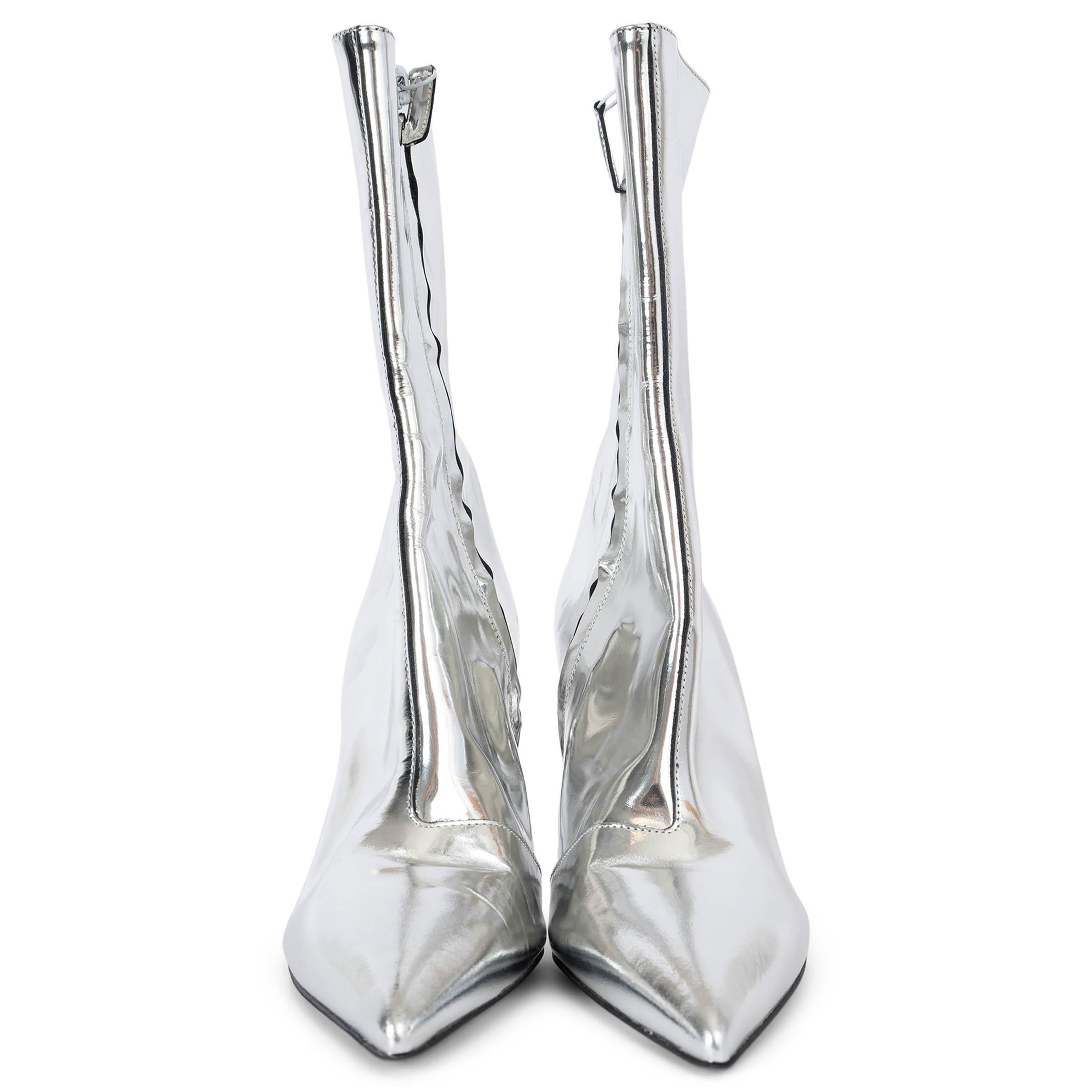 100% authentic Balenciaga Talon mirror 80 mid-calf boots in metallic silver leather. The design features a side zip fastening, a pointed toe and a mirror shine effect. The boots have never been worn but show some press marks on the leather and a