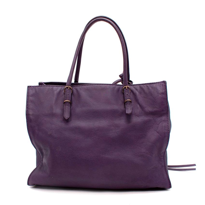  Balenciaga Mini Papier A4 Purple Leather Tote Bag
 

 - Classic Balenciaga bag style currently enjoying a 2021 revival 
 - Supple grained leather in a rich damson purple hue with aged-bronze tone hardware
 - 2 rolled top handles, with enough depth