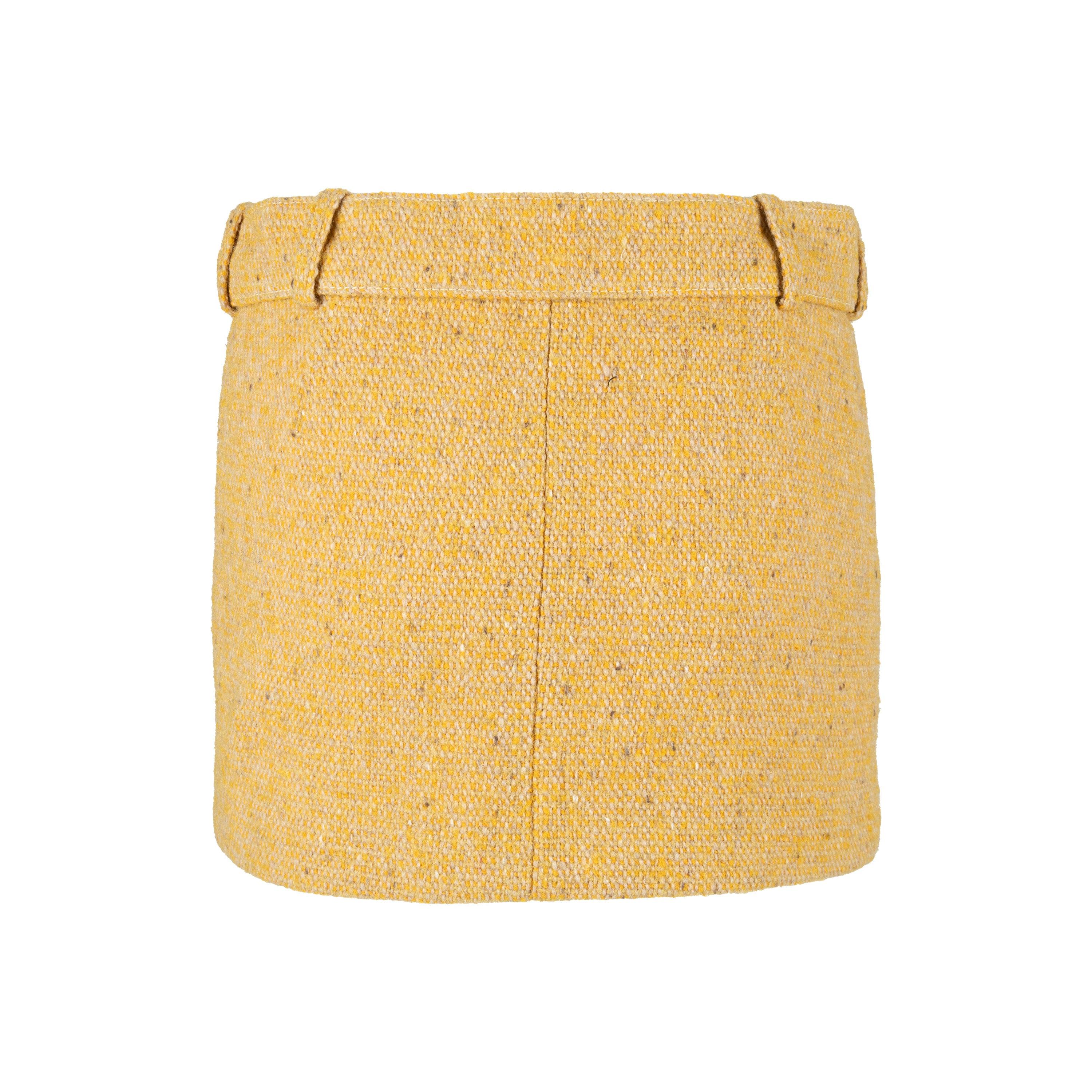 This iconic Balenciaga Mini Skirt is an archival piece from the Ghesquiere era, made from a wool blend in a soft yellow color. The short skirt has two front pockets and comes with a removable buckled belt, plus a lined interior for improved