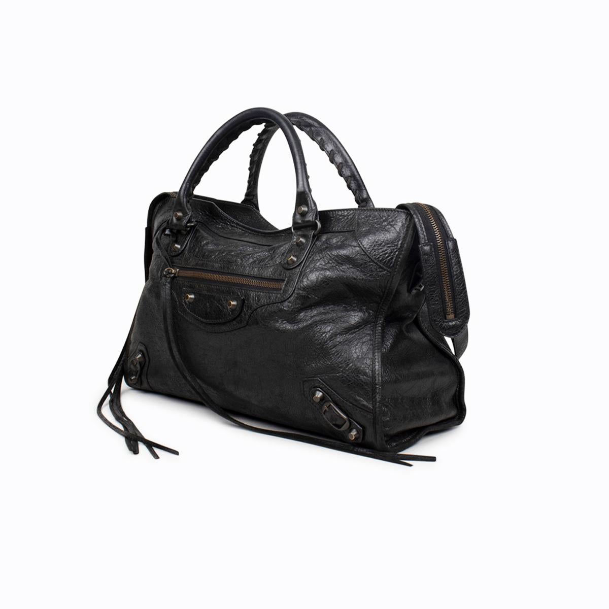 Black Arena leather Balenciaga Motocross Classic City bag with

- Brass hardware
- Detachable flat shoulder strap
- Dual rolled handles with whipstitch trim
- Zip pocket at front, black woven lining, zip pocket at interior wall and zip-closure at