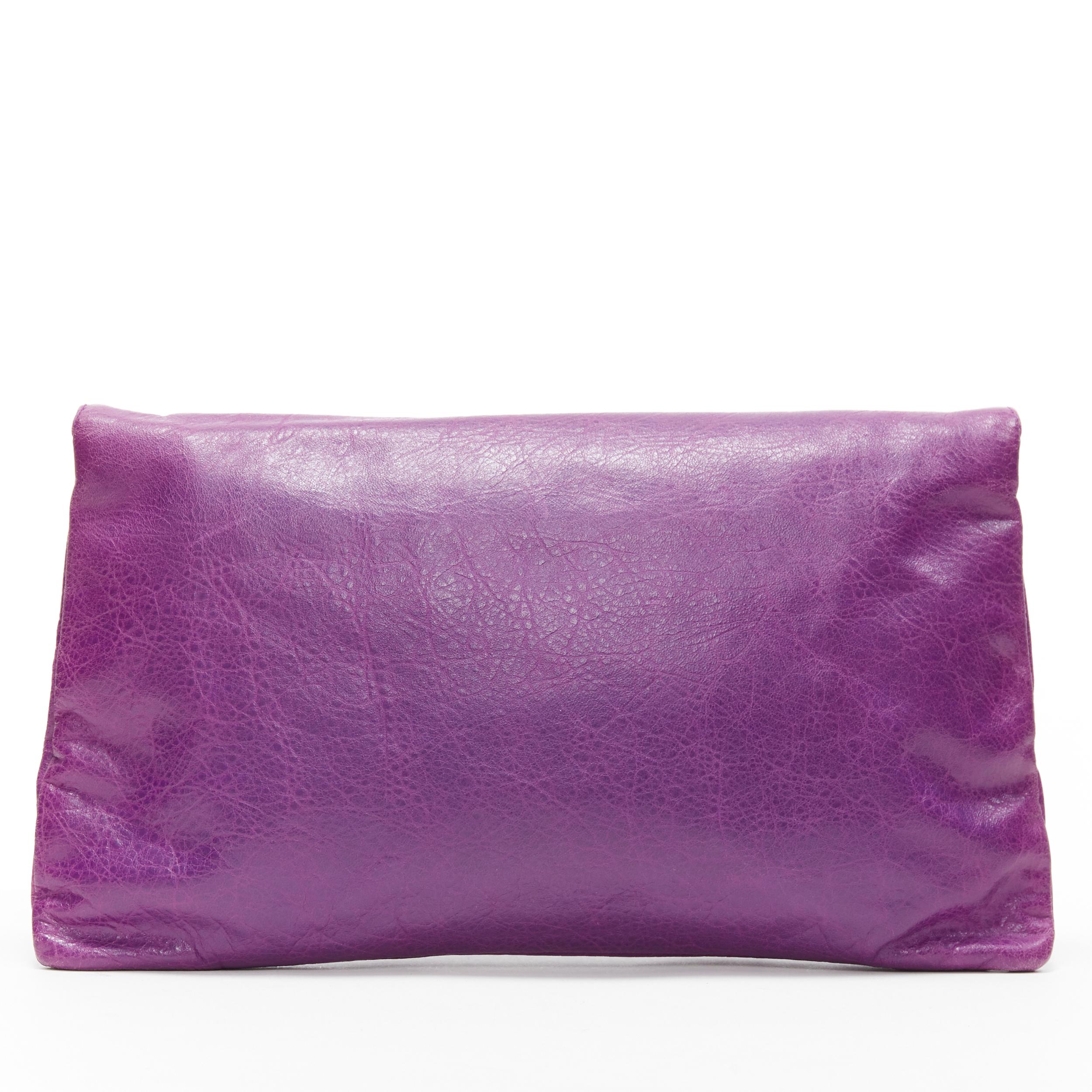 BALENCIAGA Motocross Classic purple leather brass stud flap foldover clutch bag
Brand: Balenciaga
Model Name / Style: Motocross Classic
Material: Leather
Color: Purple
Pattern: Solid
Closure: Magnetic
Extra Detail:
Made in: Italy

CONDITION: