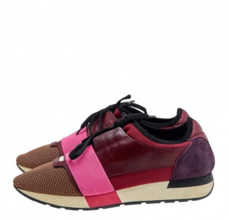 Let your latest addition be this pair of Race Runners sneakers from Balenciaga. Its exterior is crafted using leather, suede and mesh with covered toes, strap detailing on the vamps, and lace-up fastenings. This pair is completed with a