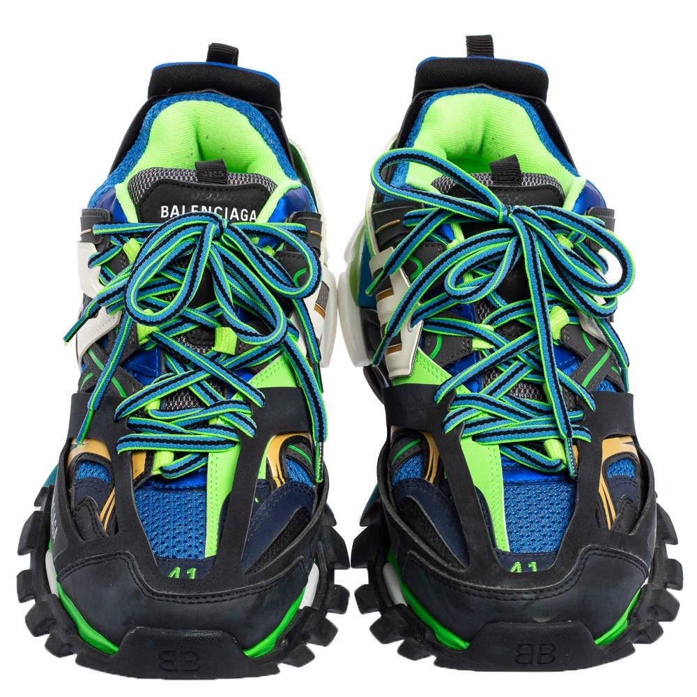black and green track runners