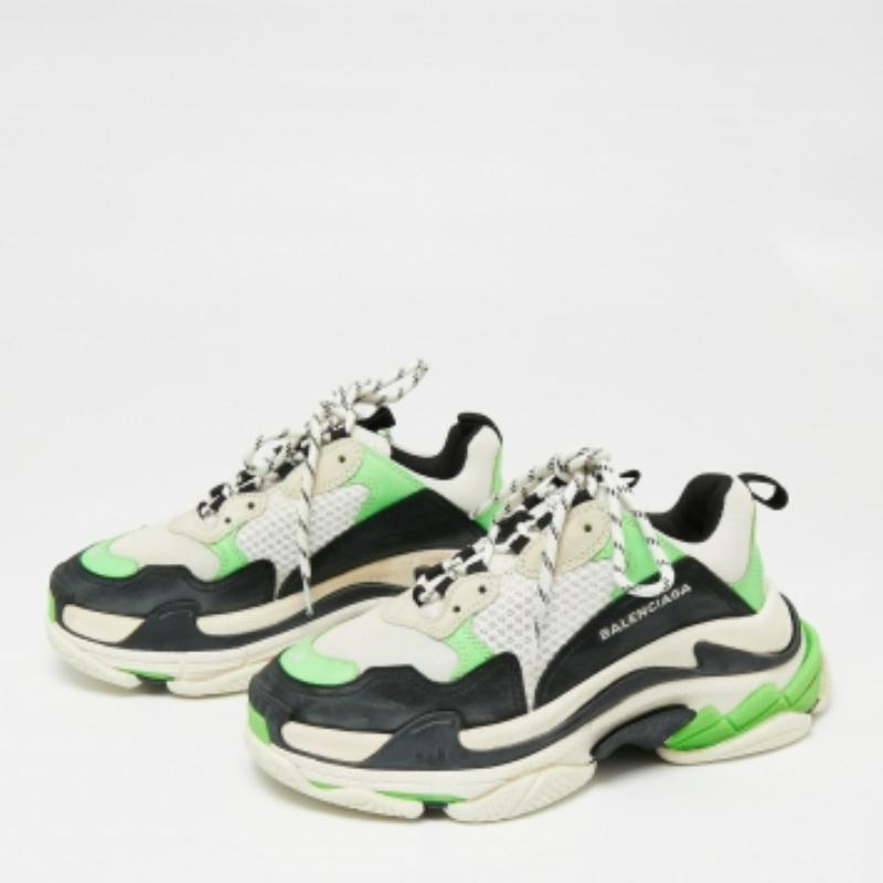 One of Balenciaga's many hit designs, the Triple S is a shoe that strays away from minimal forms and simple silhouettes. These are crafted from a mix of materials into a chunky size, achieved by the high complex soles. They feature the shoe size on