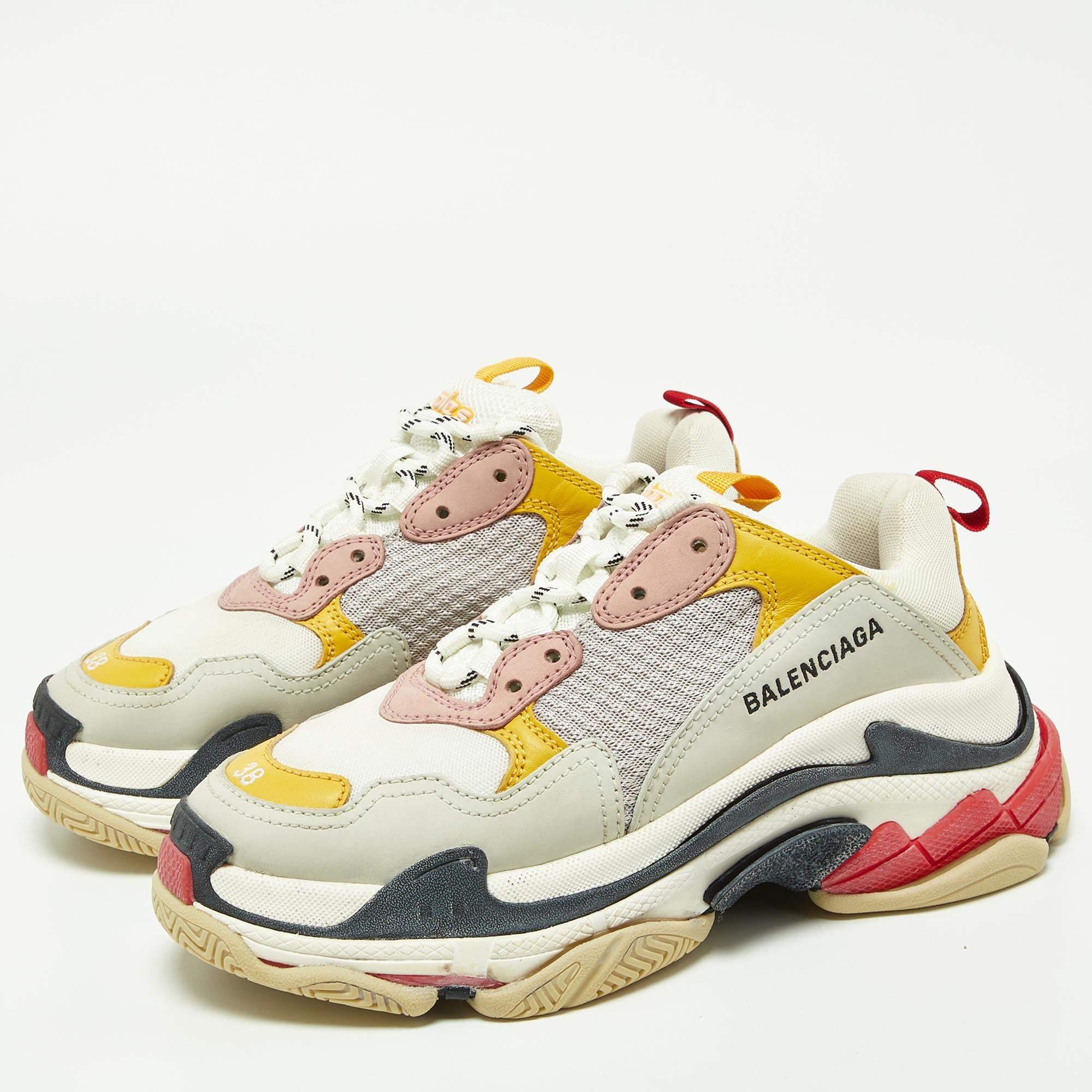 Coming in a classic silhouette, these Balenciaga Triple S sneakers are a seamless combination of luxury, comfort, and style. These sneakers are finished with signature details and comfortable insoles.

