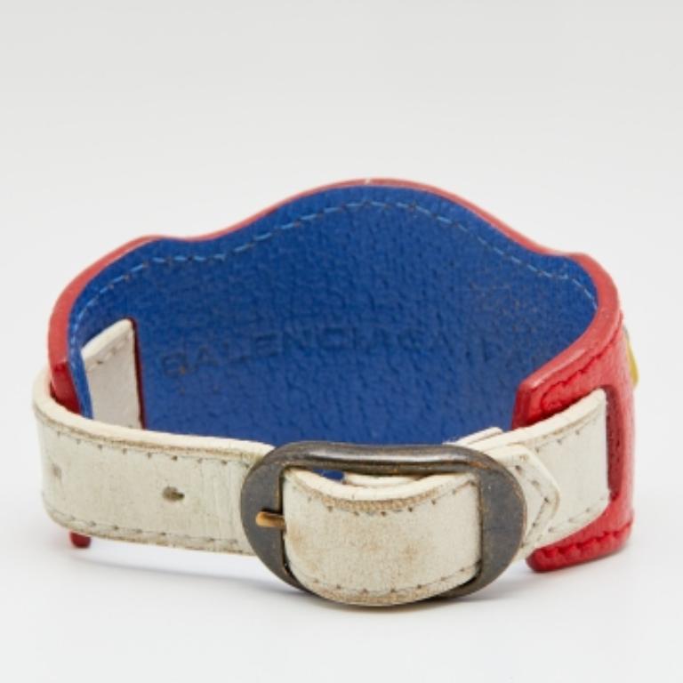 Adorn your wrist with this Balenciaga Arena bracelet. In multi-colored Leather, the bracelet features studs and an adjustable ornamented buckle ornament. Style this with your work or casual attire and break the monotony from your neutral and solid