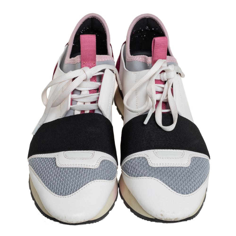 Let your latest shoe addition be this pair of Balenciaga Race Runners sneakers. These sneakers have been crafted from a blend of quality materials and feature a chic silhouette. They flaunt covered toes, strap detailing on the vamps, and tie-up