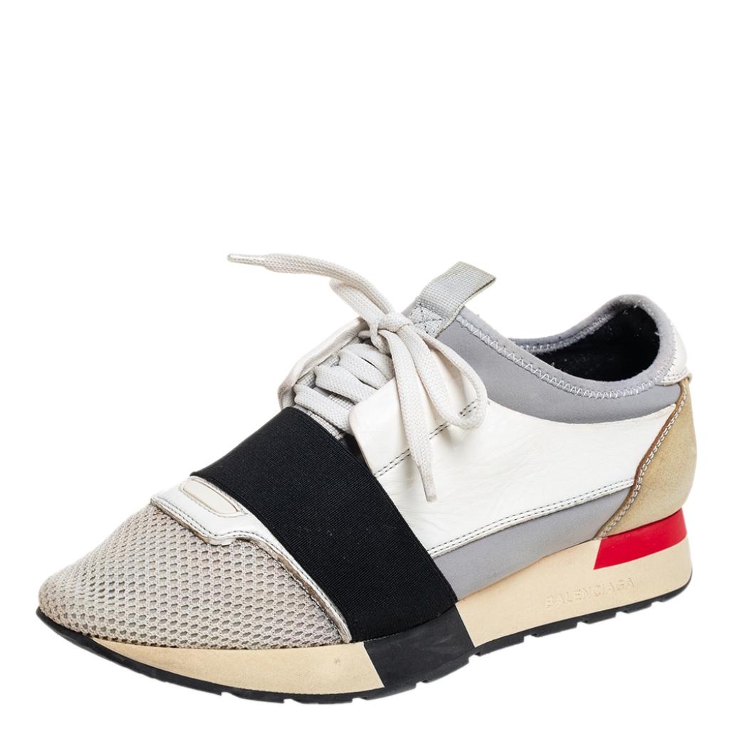 Let your latest shoe addition be this pair of Balenciaga Race Runners sneakers. These sneakers have been crafted from mesh, and leather and feature a chic silhouette. They flaunt covered toes, strap detailing on the vamps, and tie-up fastenings.