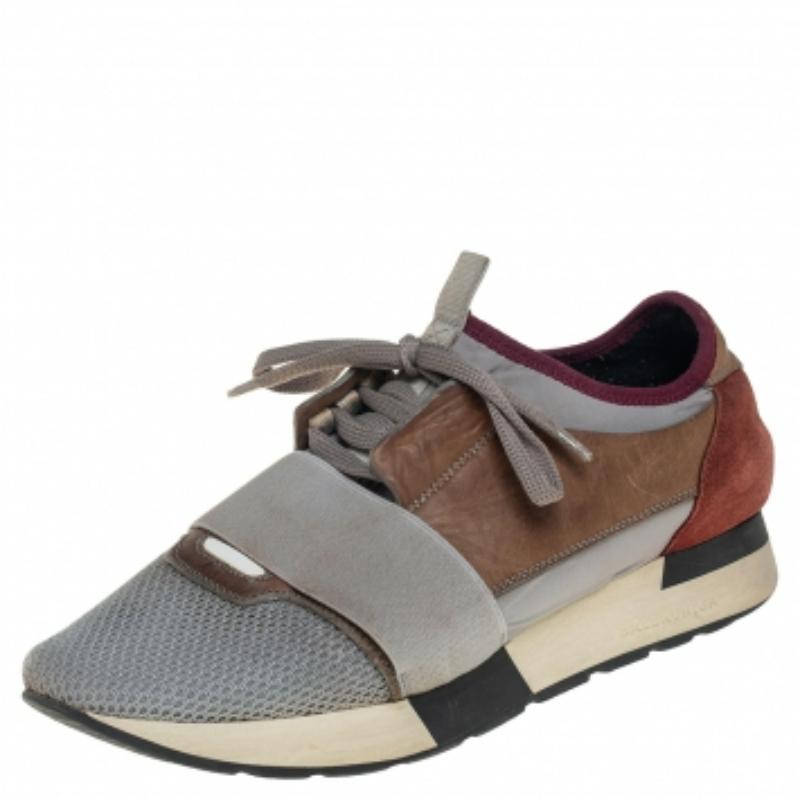 Let your latest shoe addition be this pair of Balenciaga Race Runners sneakers. These sneakers have been crafted from a blend of quality materials and feature a chic silhouette. They flaunt-covered toes, strap detailing on the vamps, and tie-up