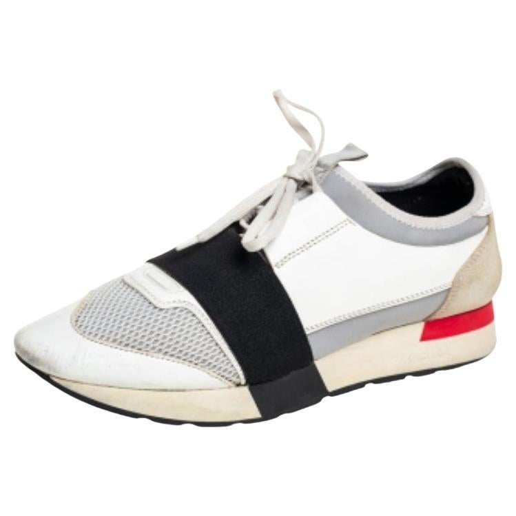 Let your latest shoe addition be this pair of Race Runners sneakers from Balenciaga. These sneakers have been crafted from a blend of quality materials and feature a chic silhouette. They flaunt covered toes, strap detailing on the vamps, and tie-up