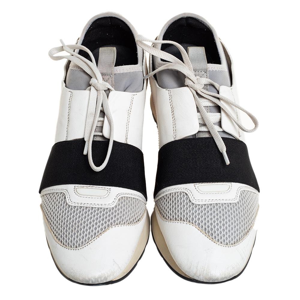 Let your latest shoe addition be this pair of Race Runners sneakers from Balenciaga. These sneakers have been crafted from a blend of quality materials and feature a chic silhouette. They flaunt covered toes, strap detailing on the vamps, and tie-up