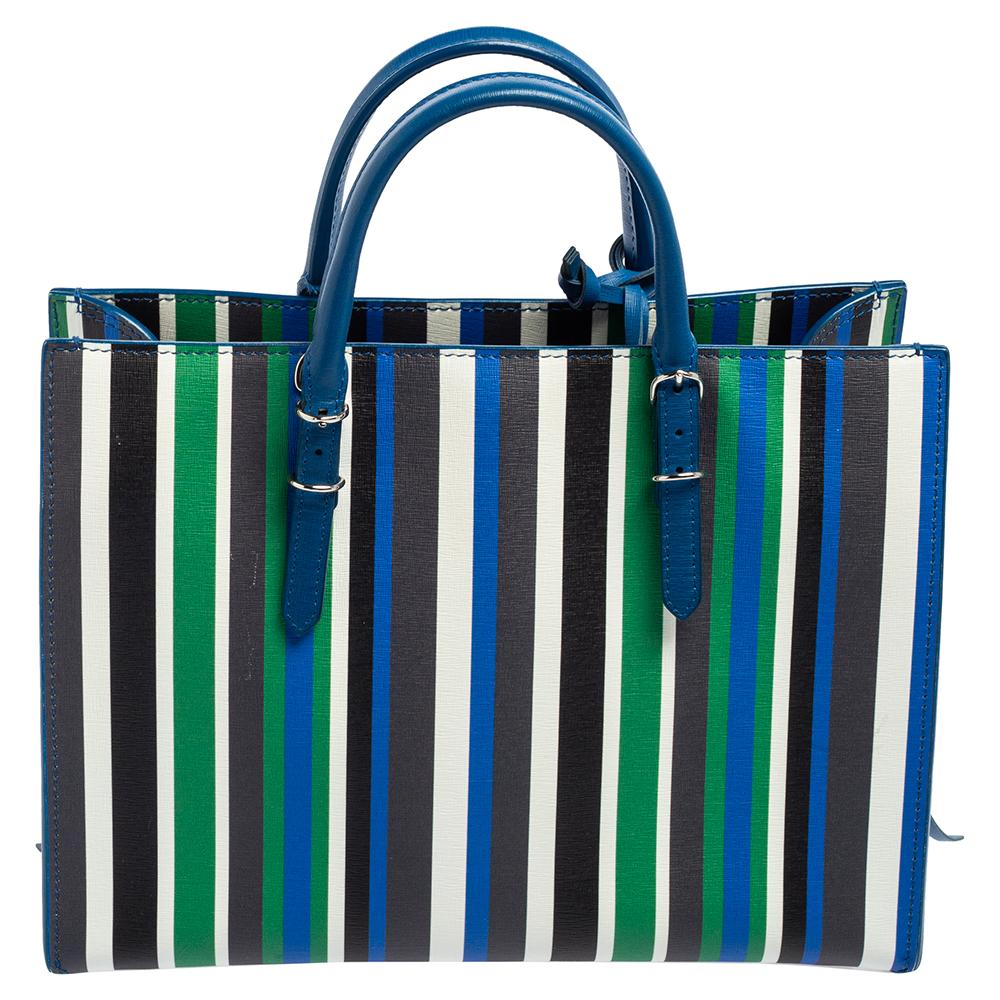 This Papier A6 bag from Balenciaga smoothly blends luxury with practical fashion. It comes crafted from striped leather and styled with two top handles, a leather interior, and a detachable strap. The front is detailed with a signature zipper and