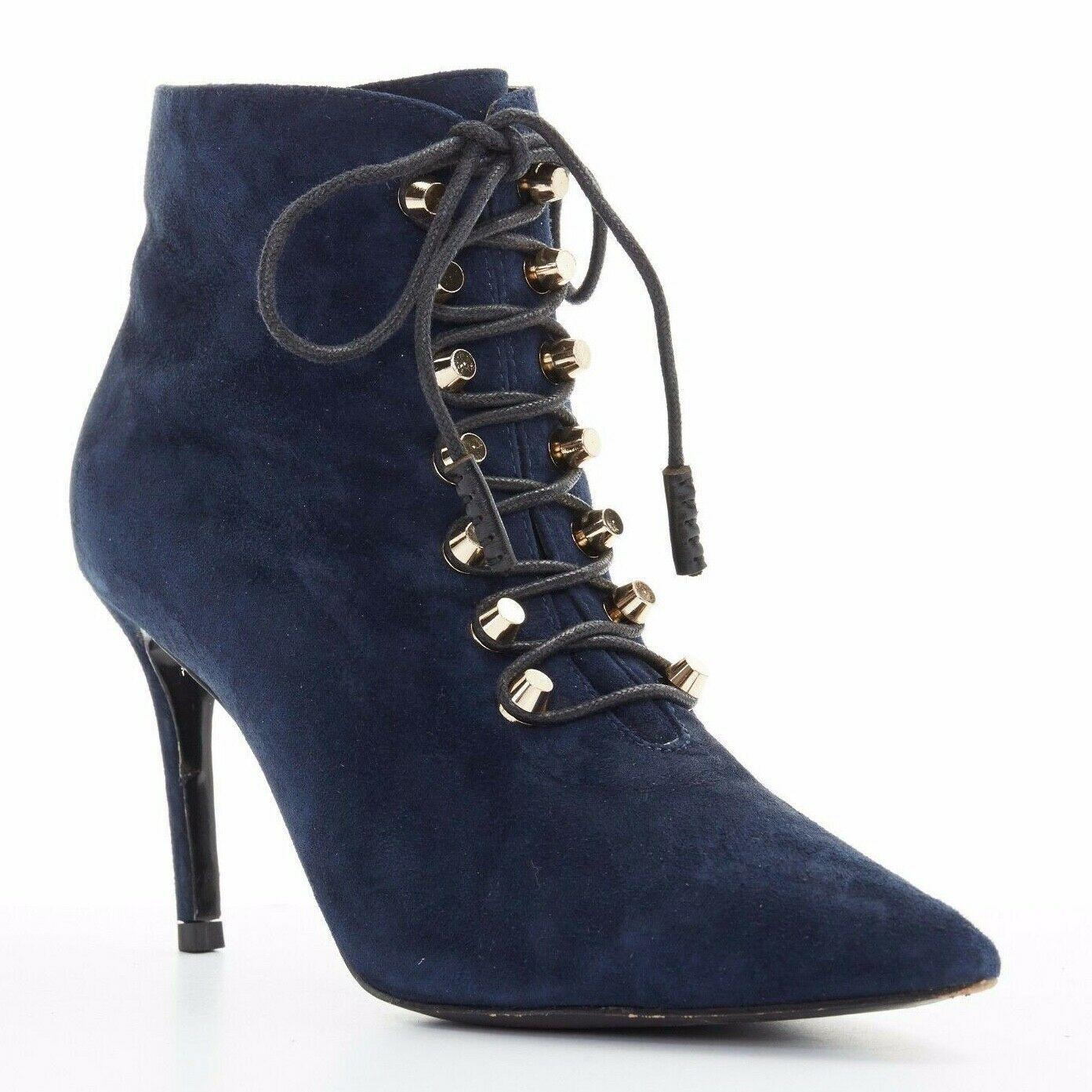 BALENCIAGA navy blue suede gold-tone stud lace up point toe ankle bootie EU37
Designer: Balenciaga
Material: Leather
Extra Details: Navy suede leather upper. Copper-tone hardware. Waxed leaces. Lace up front closure. Pointed toe. Slim heel. Zip on