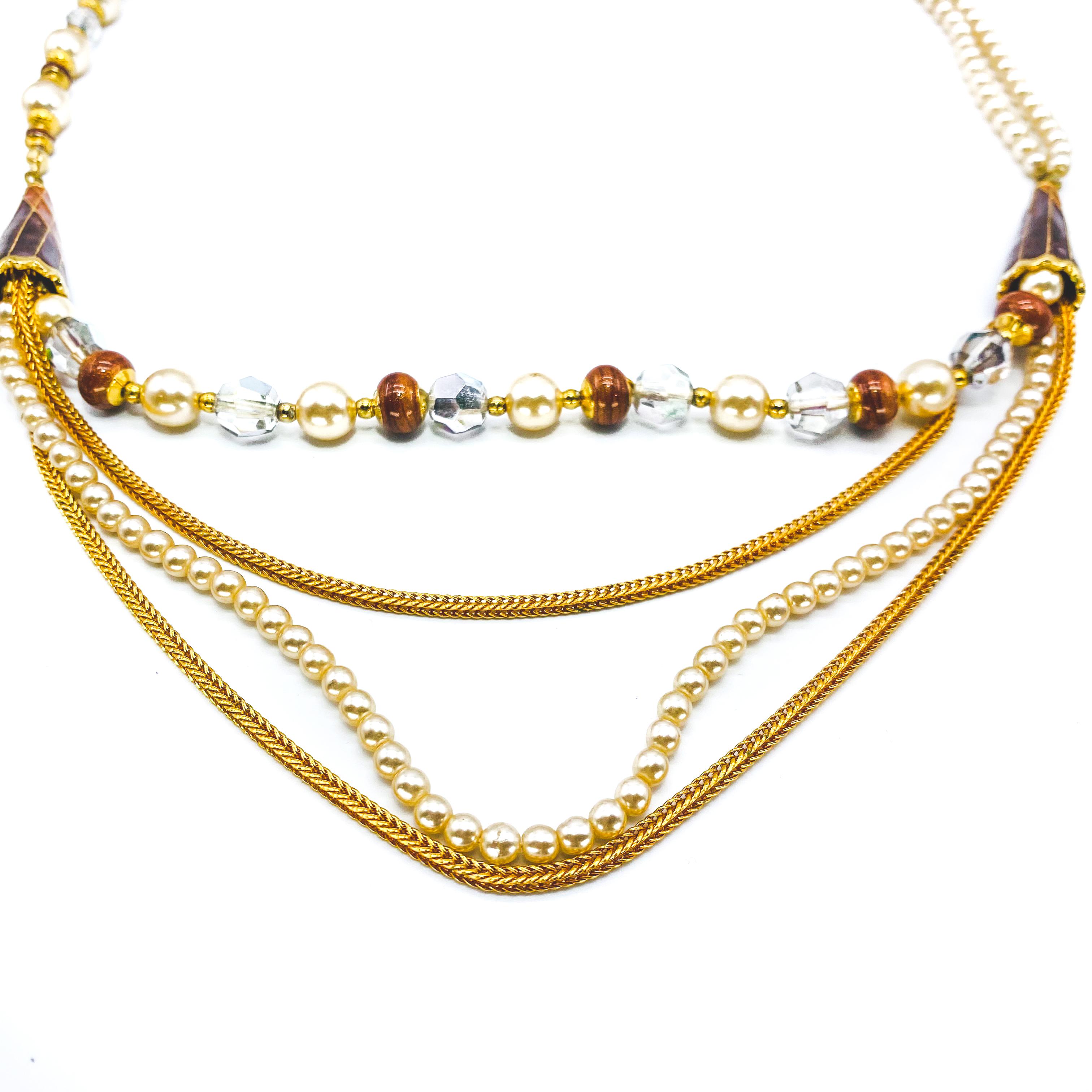 Balenciaga Vintage 1970s Multistrand Necklace

Beautiful multi-strand necklace from the iconic Cristobal Balenciaga

Detail
-Made in France in Italy in the early 1970s
-Asymmetrical design
-Simulated pearls with gold plated hardware

Size &