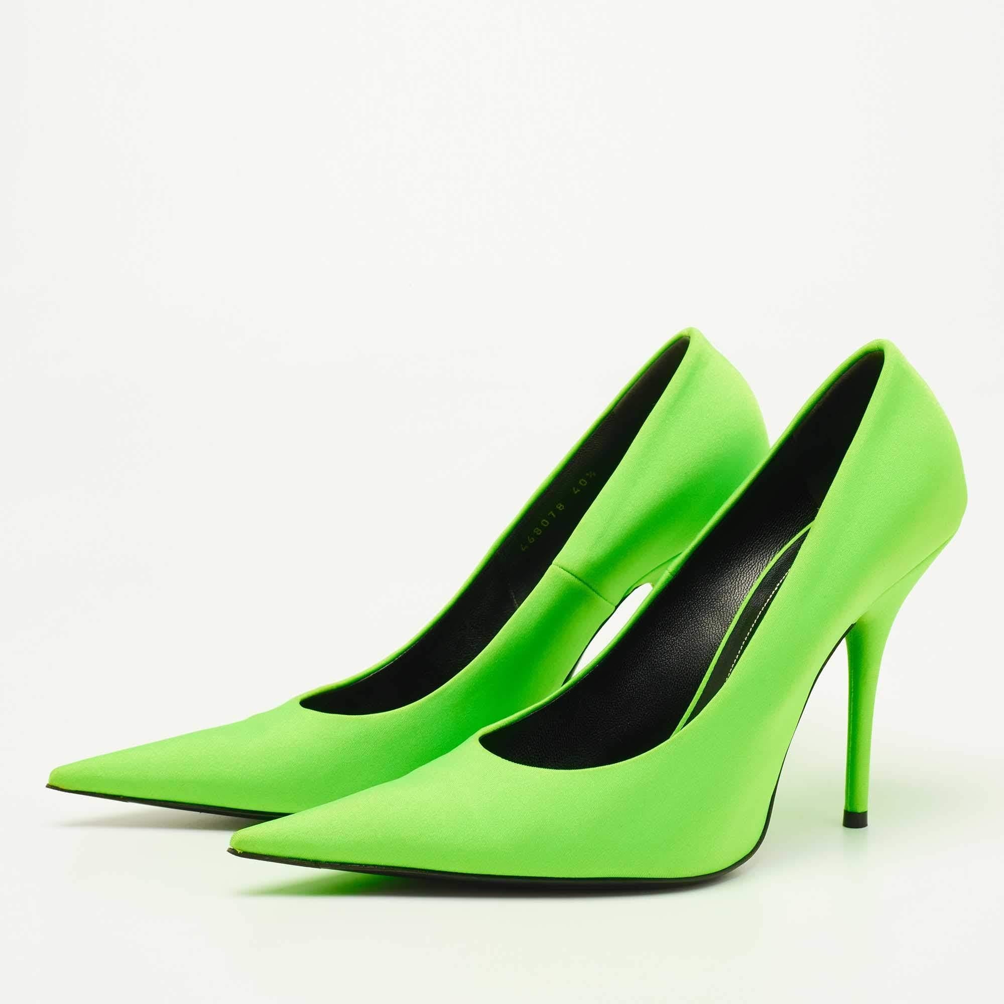Sleek and sharp, this pair of Balenciaga pumps will complement a variety of outfits in your wardrobe. The nylon creation features a green hue and pointed toes. Elevated on 11.5cm heels, it will take your fashion statement a notch higher.

