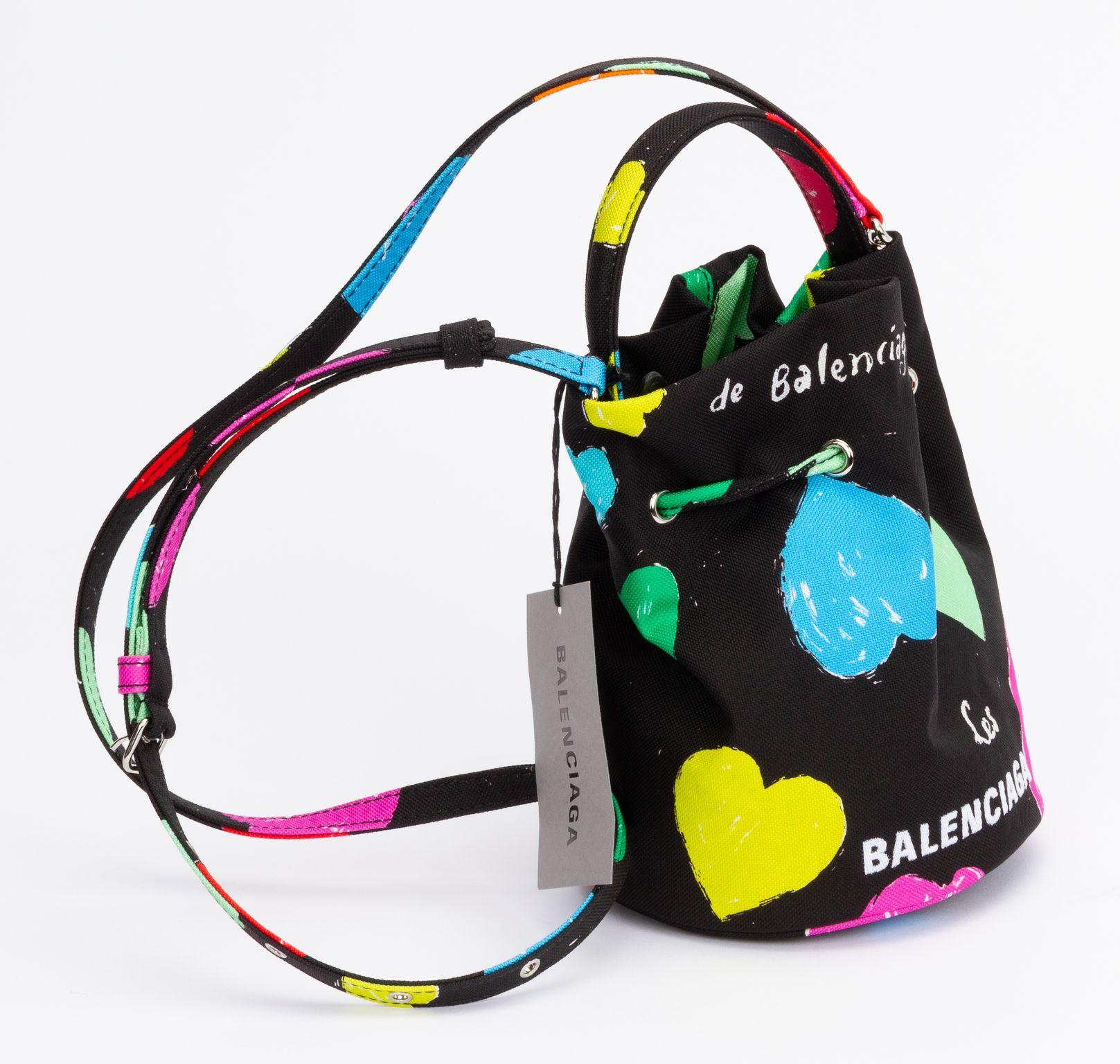 Balenciaga new small 2 way bucket bag. Handbag or cross body. Black toile with colorful hearts design. Adjustable and detachable shoulder strap (drop 15