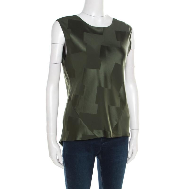 This Balenciaga top is a breath of fresh air in a world of generics. Made from satin, the sleeveless top comes in olive green with jacquard detailing and a back tie. Wear it with pants and high heels.

Includes: The Luxury Closet Packaging

The