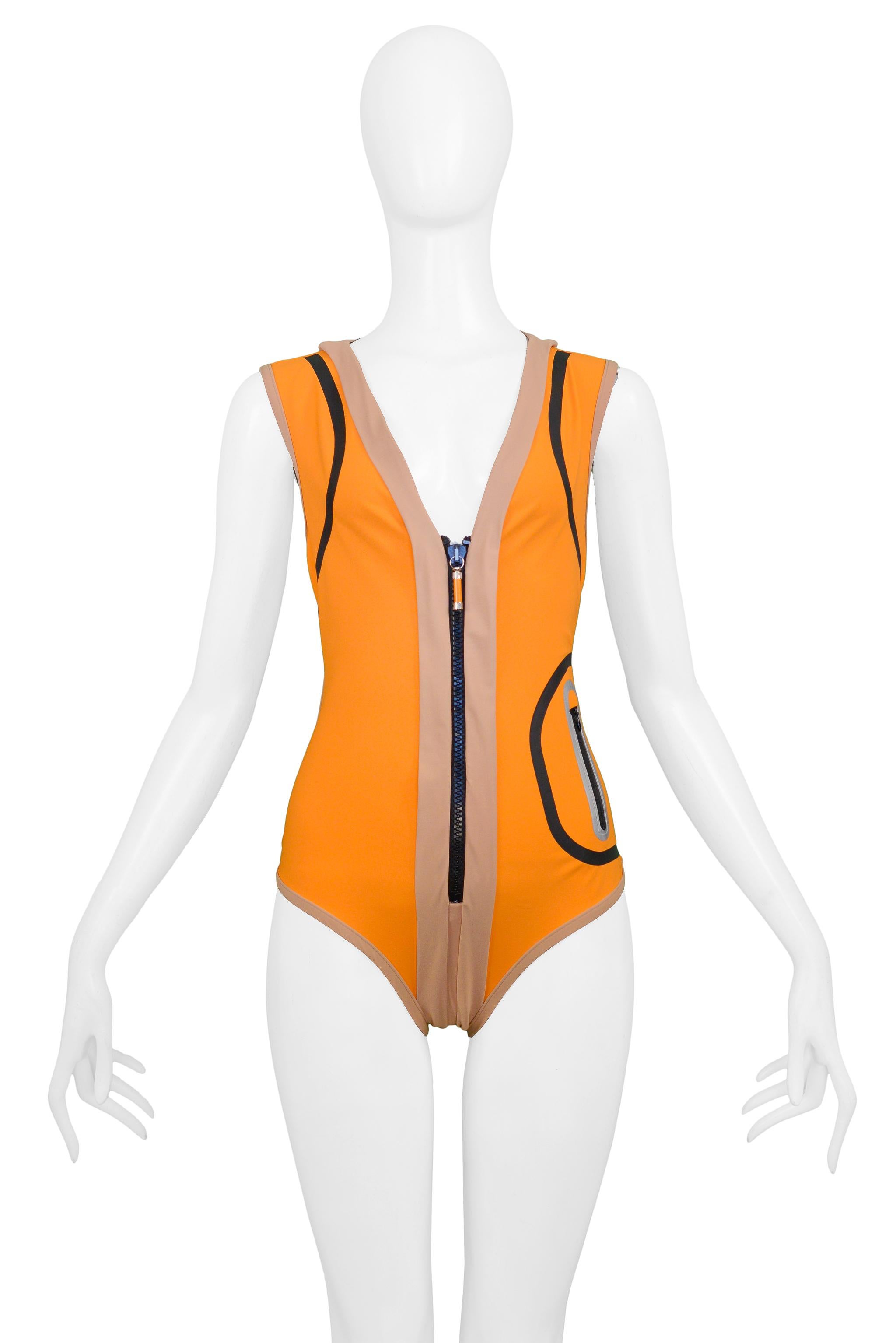 Resurrection Vintage is excited to offer an iconic orange Balenciaga by Nicolas Ghesquiere swimsuit featuring a center front black zipper with tech chrome and orange Balenciaga pull, black detailing, a side zipper pocket with reflective detail, and