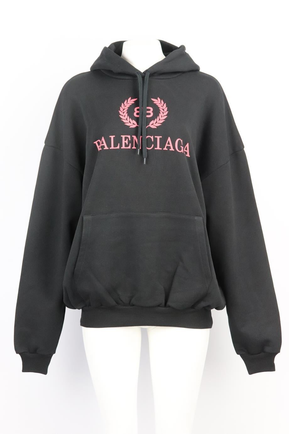 Balenciaga oversized printed cotton jersey hoodie. Black. Long sleeve, crewneck. Slips on. 100% Cotton. Size: Meduim (UK 10, US 6, FR 38, IT 42). Bust: 56 in. Waist: 54 in. Hips: 35 in. Length: 26 in. Very good condition - As new condition, no sign