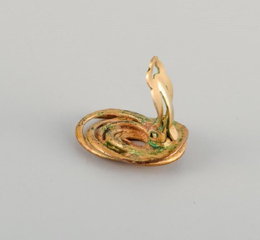 Women's Balenciaga, Paris. Brooch and a pair of ear clips in bronze. Late 1900s.  For Sale