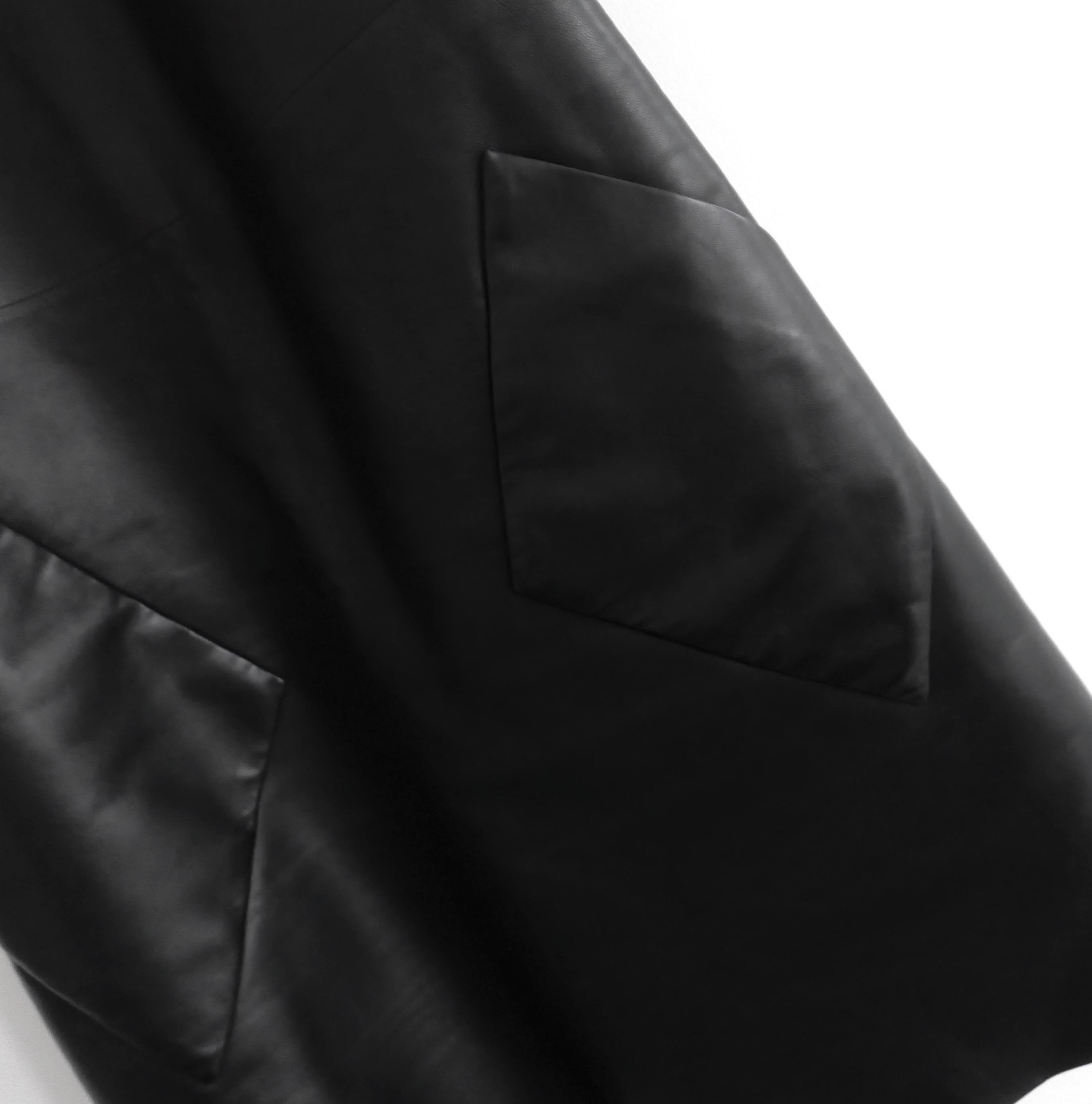 Super sharp and chic Balenciaga leather dress from the Resort 2015 collection. Bought for £2950 and worn once. Made from smooth black lamb leather with a semi structured polyamide backing. It has an a-line shape with large, slanted patch pockets and