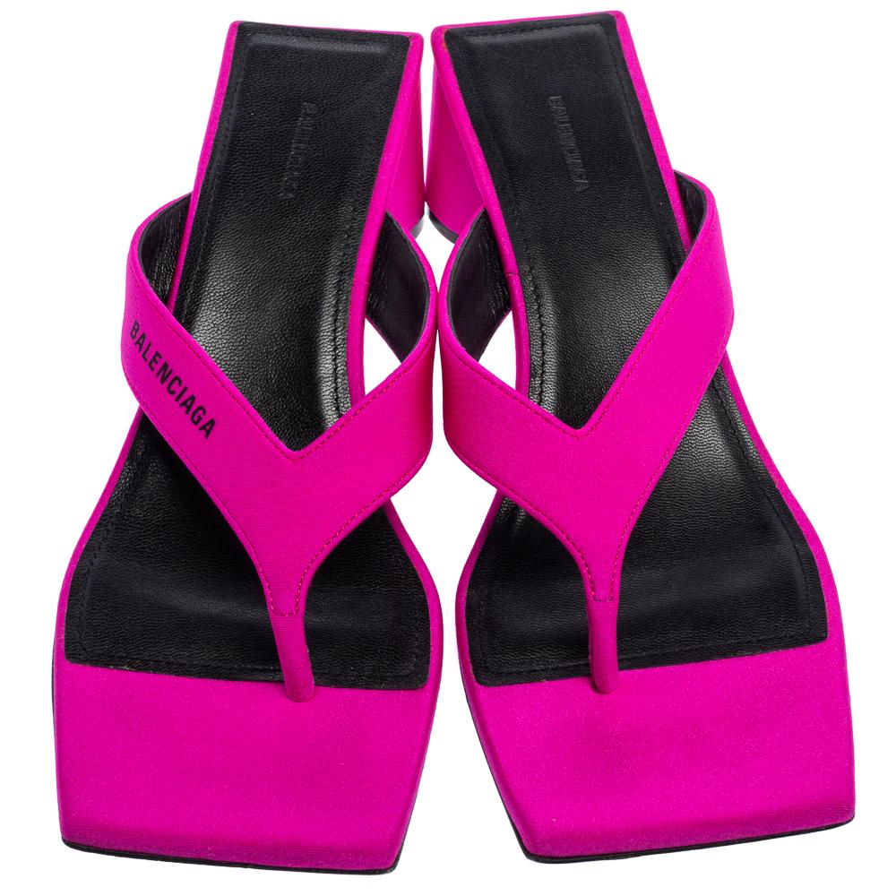 Demna Gvasalia likes to play with neon shades for Balenciaga's collections, and the resulting designs are unique and cool. They have been made in Italy from pink satin and have a square-toe silhouette with logo-printed straps. The sturdy block heels