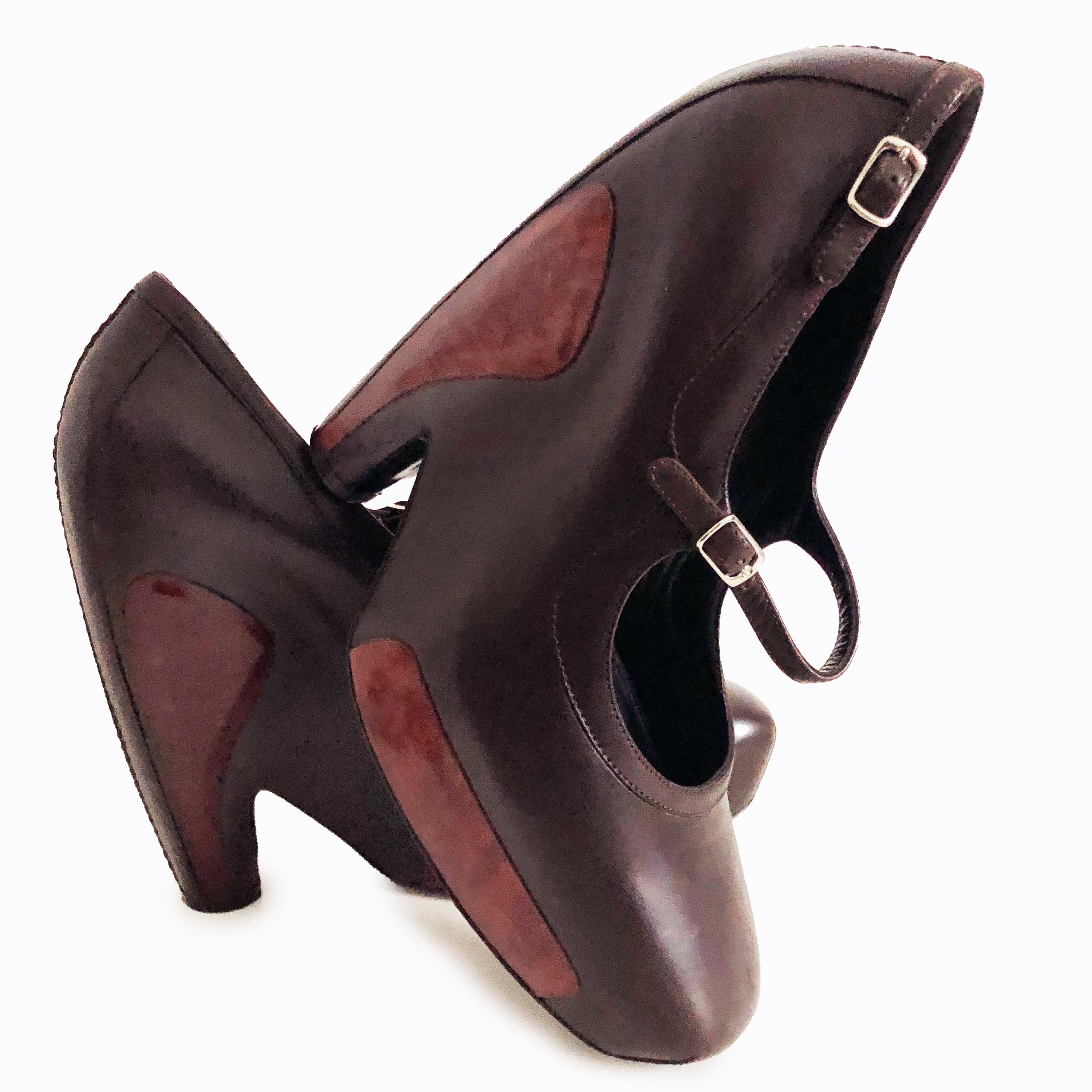 Iconic Balenciaga leather platforms with wood inserts, from the F/W 2006 collection by Nicolas Ghesquiere.  Crafted from brown leather, these Mary Jane style shoes fasten with a thin strap across the top, with squared off toes and incredibly high