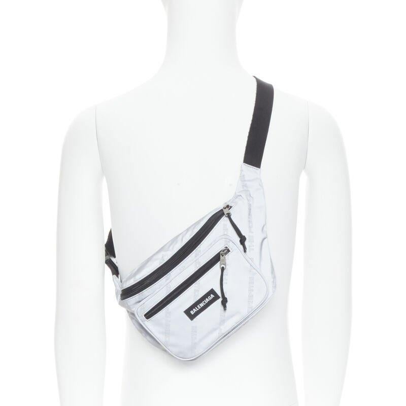 BALENCIAGA Power Of Dreams 3M reflective nylon Explorer crossbody belt bag
Reference: TGAS/B01383
Brand: Balenciaga
Designer: Demna
Model: Power Of Dreams waist bag
Material: Nylon
Color: Silver
Pattern: Solid
Closure: Zip
Lining:  Nylon
Extra
