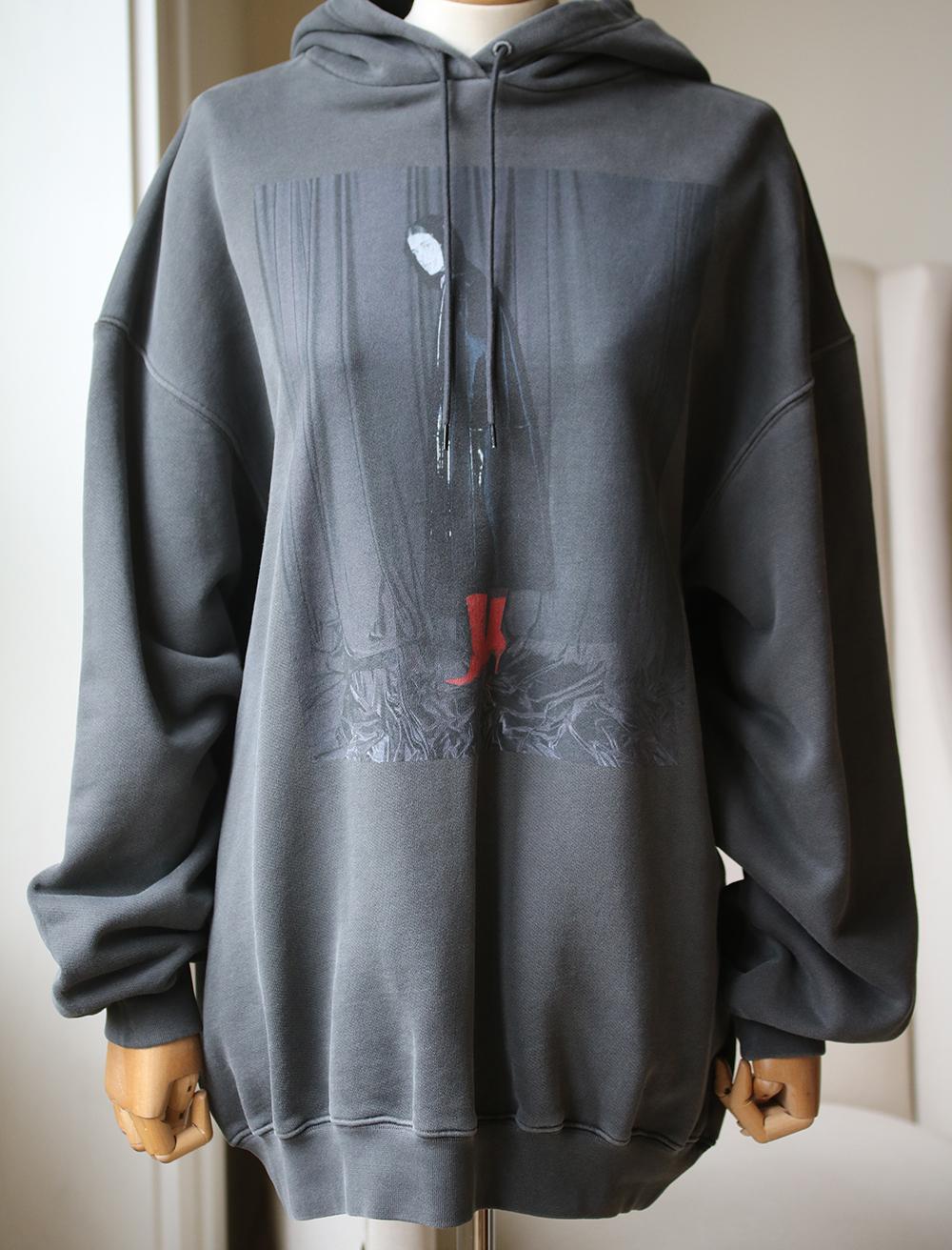 Demna Gvasalia often references Balenciaga's past collections in his designs - this hooded sweatshirt features a photograph taken by Harley Weir for the brand's Spring '17 campaign. It's cut from faded charcoal cotton-jersey in an oversized shape