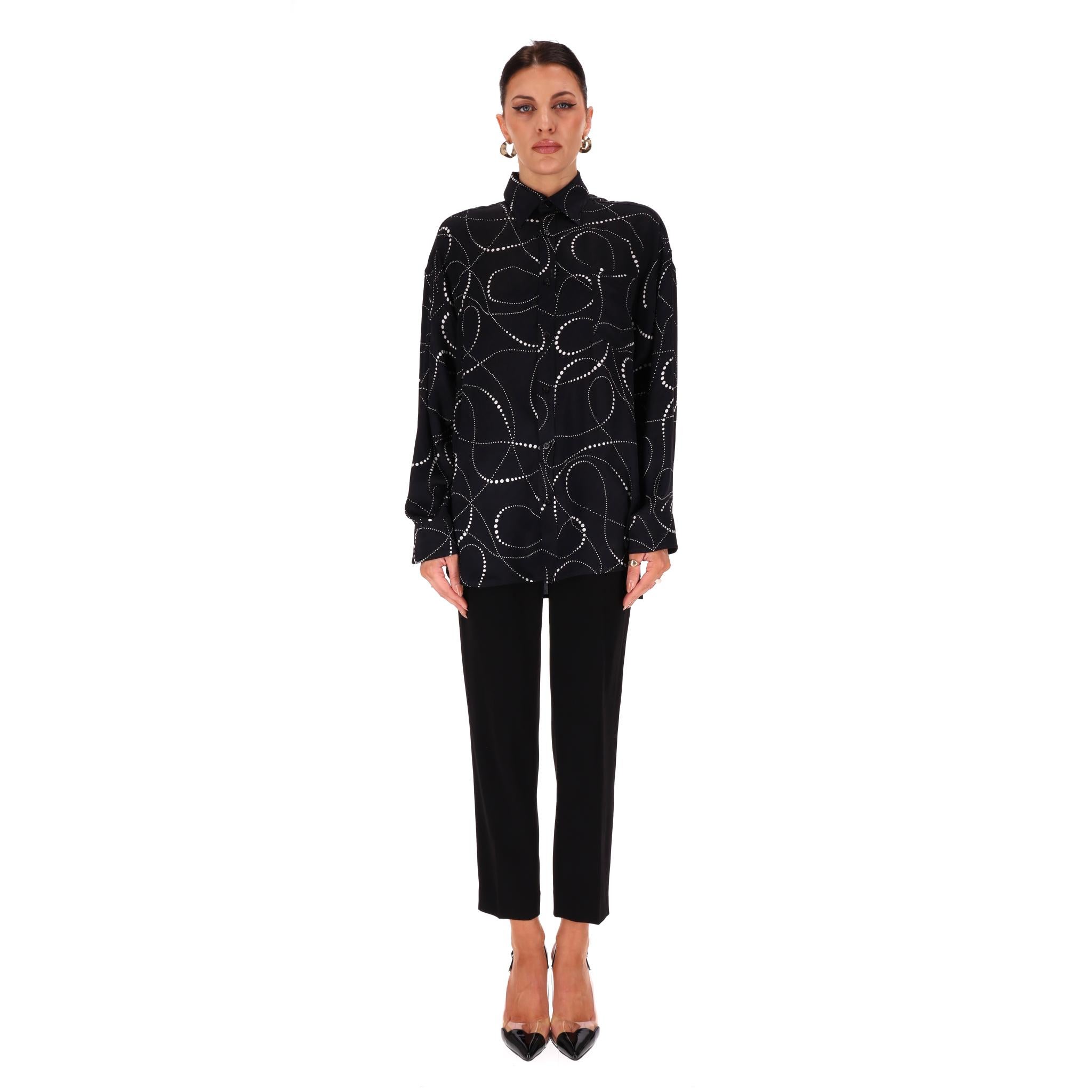 Balenciaga Printed Silk Shirt

Black oversized shirt fully crafted from cotton and designed with all-over abstract print in white.

Featuring 'Balenciaga' embossed button through the centre, collared neckline and buttoned cuffs.

Rrp Approx.