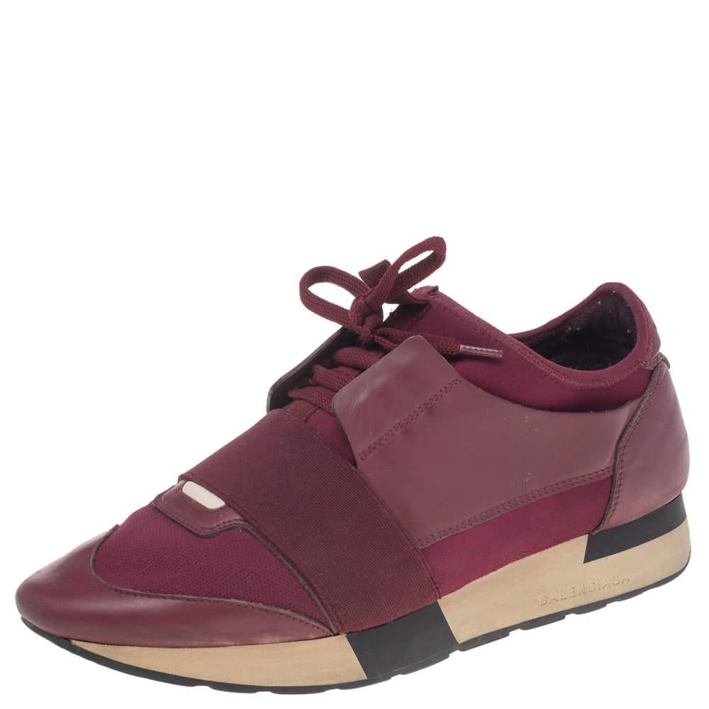 Let your latest shoe addition be this pair of Race Runners sneakers from Balenciaga. These purple sneakers have been crafted from leather & mesh and feature a chic silhouette. They flaunt covered toes, strap detailing on the vamps, and tie-up